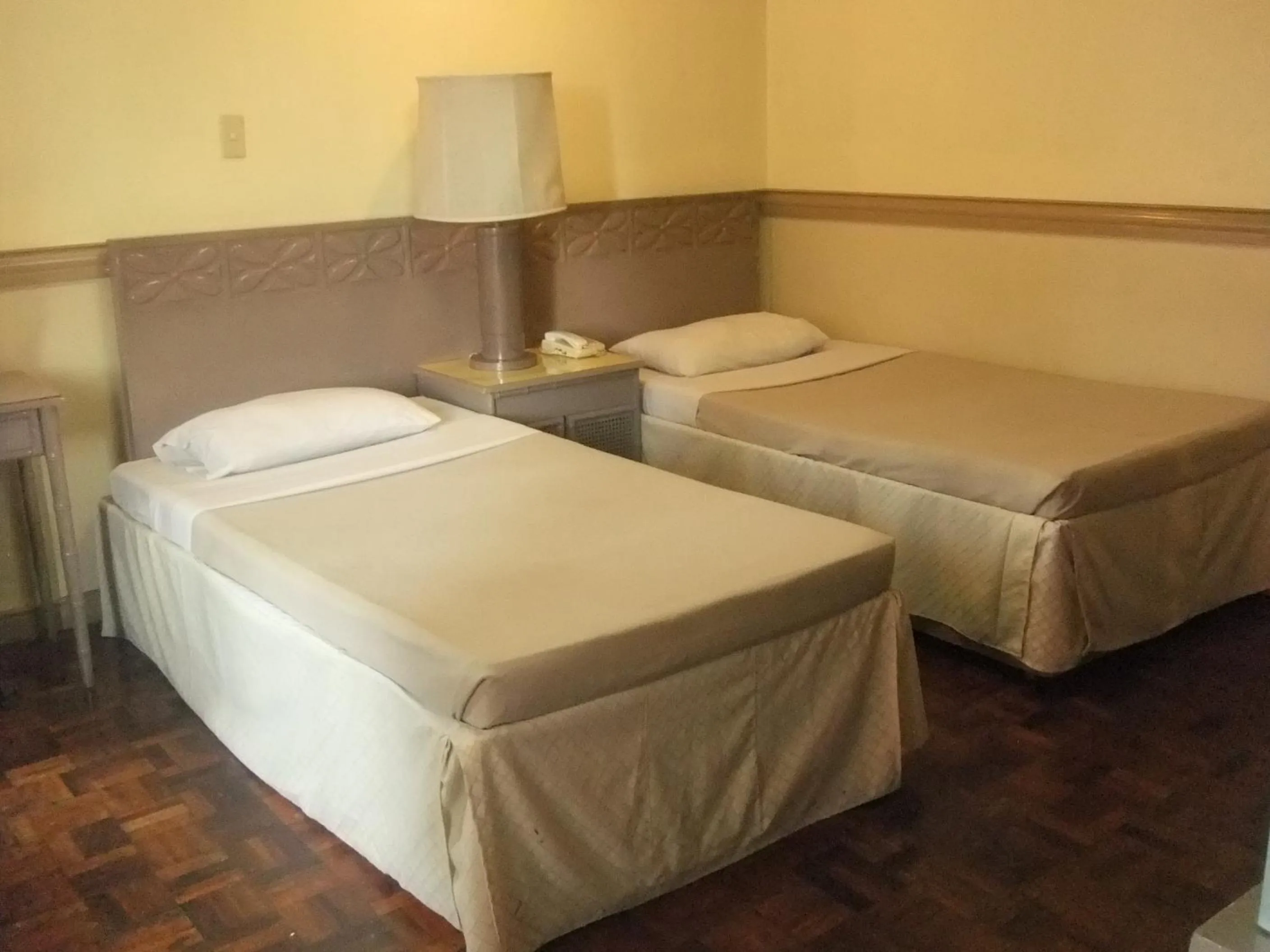Bed in Manila Manor Hotel