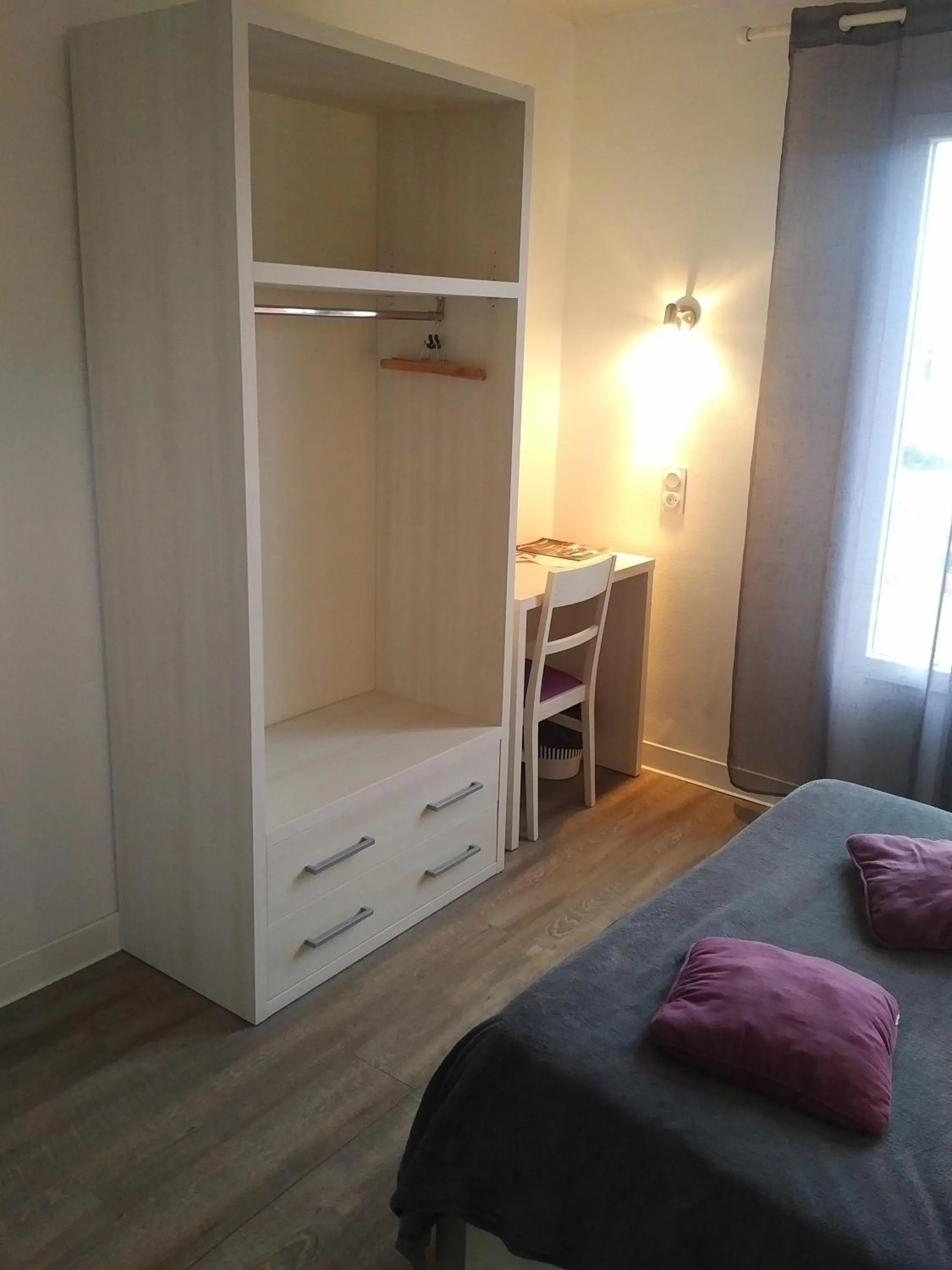 Bed in Logis Hôtel Le pont d'Arcole