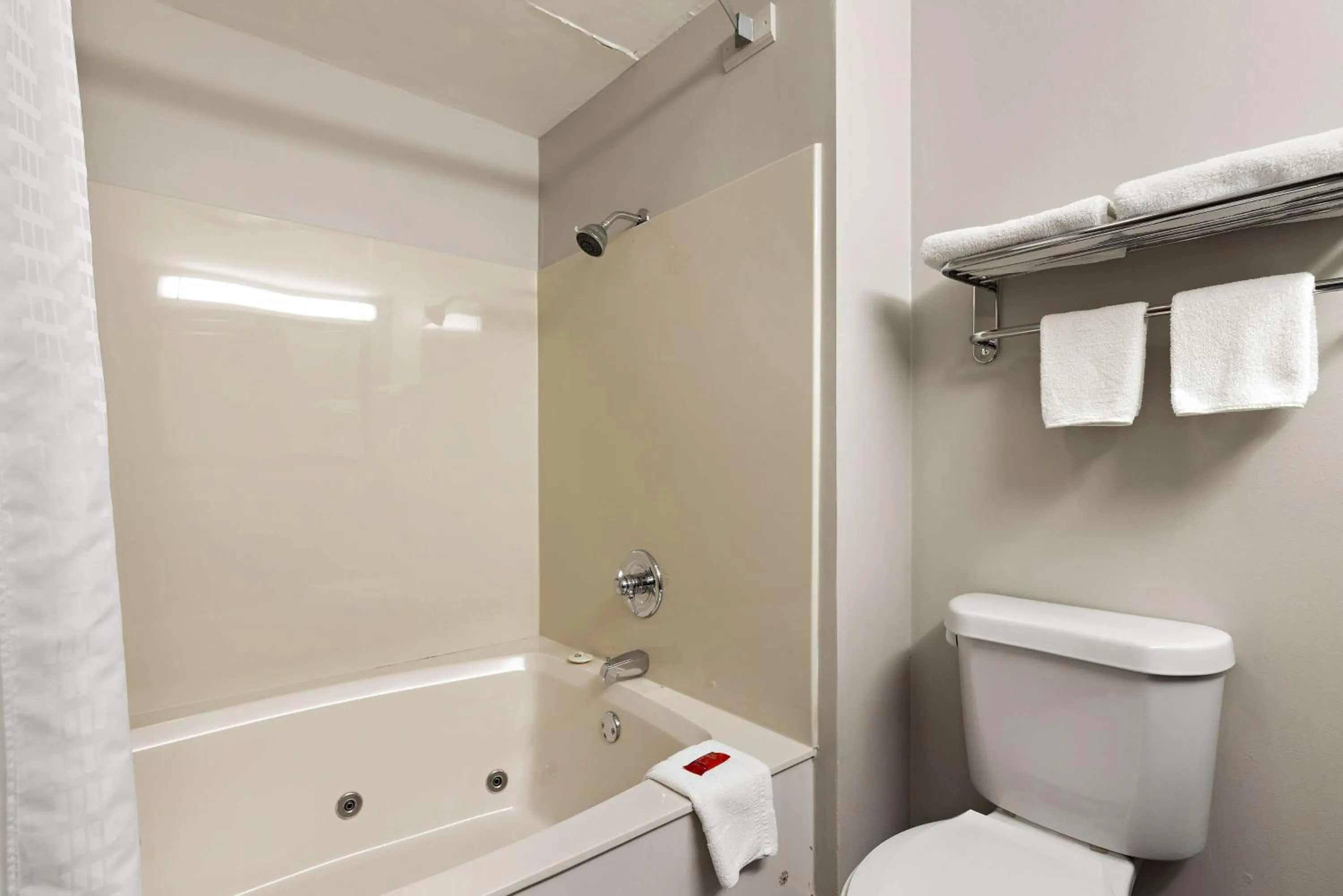Bathroom in SureStay Plus Hotel by Best Western Tulsa East