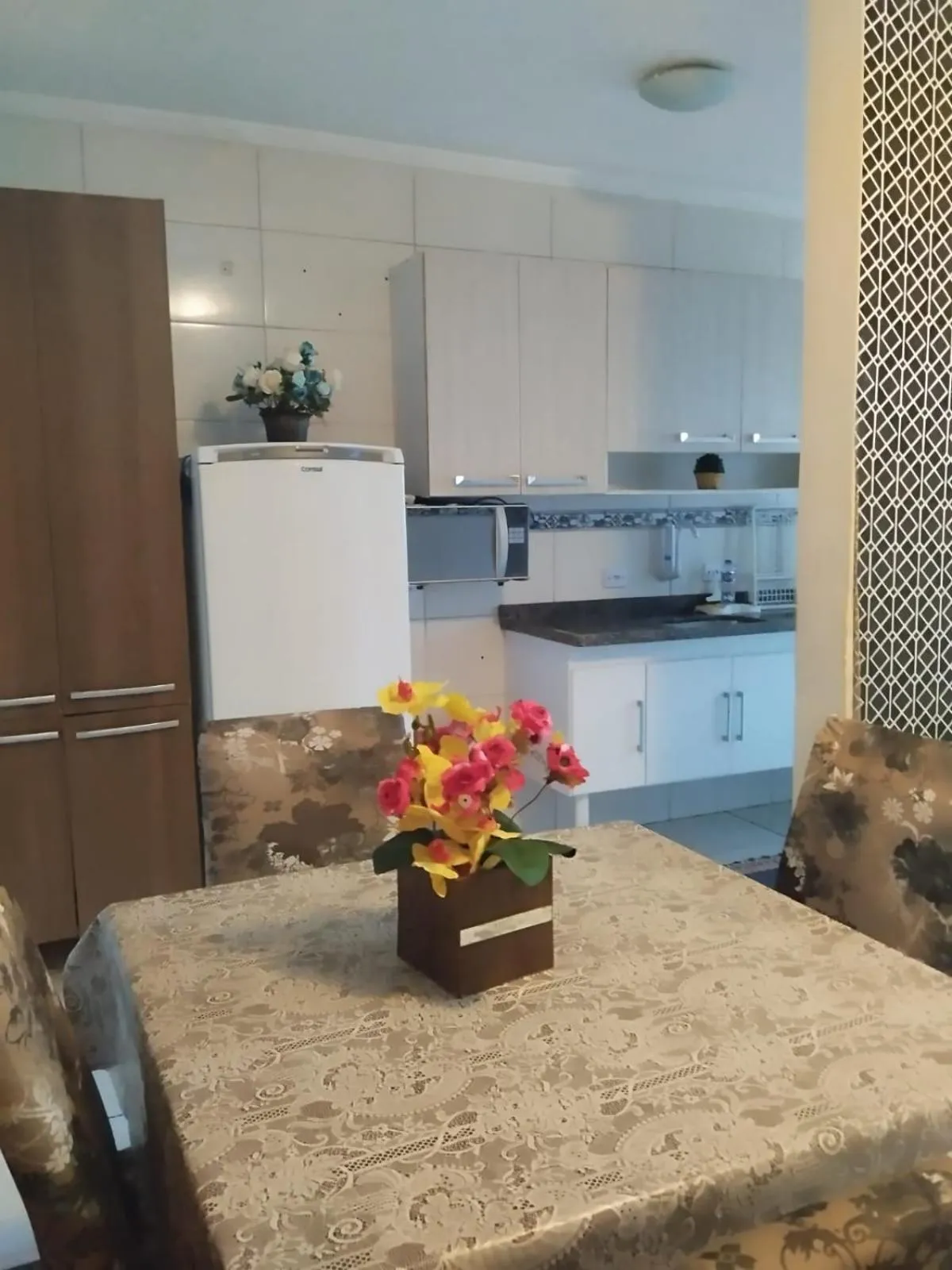 kitchen in Apê Temporada Praia Grande SP Completo com Piscina, Churrasqueira, Estacionamento