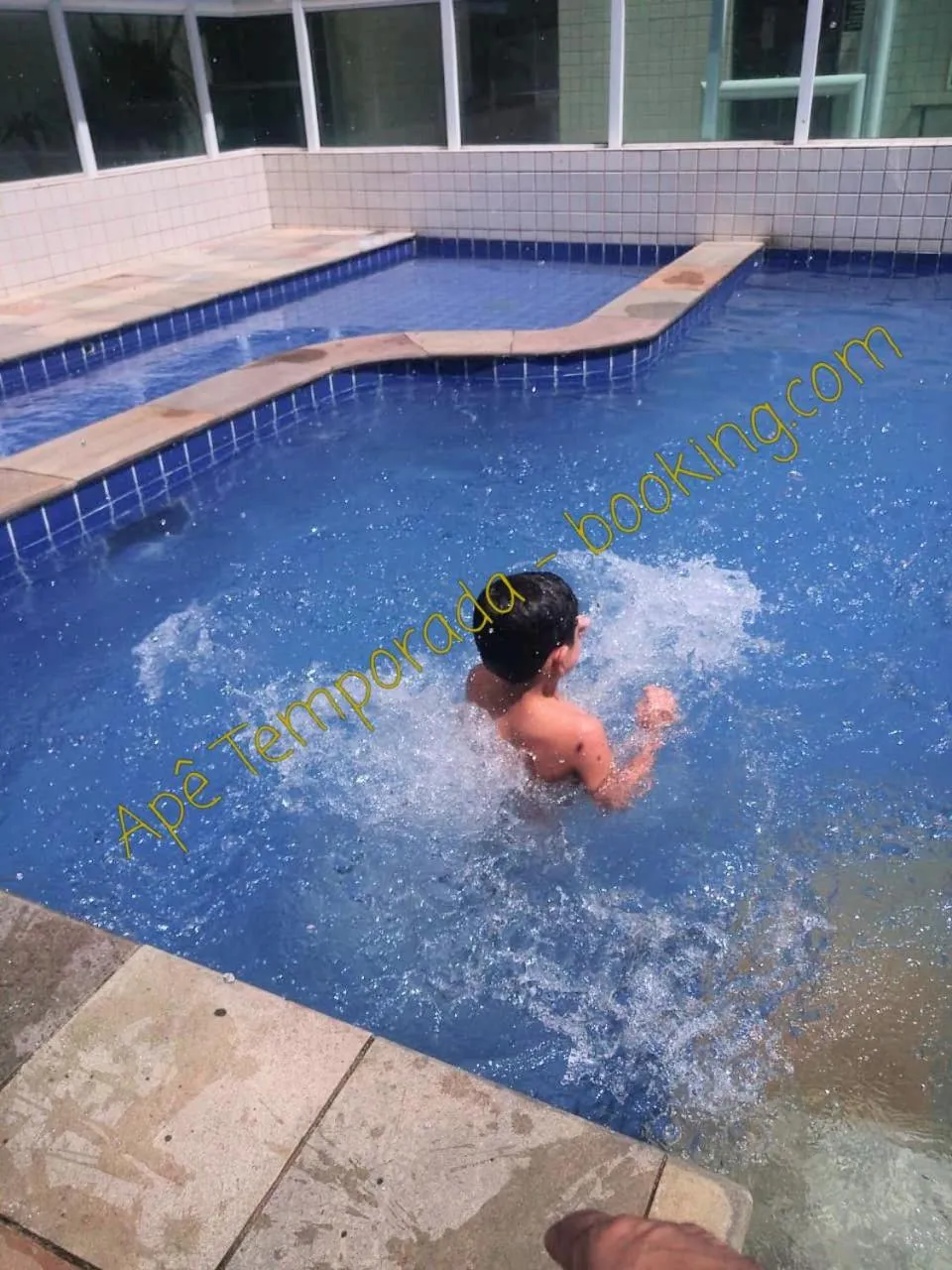 Swimming pool in Apê Temporada Praia Grande SP Completo com Piscina, Churrasqueira, Estacionamento