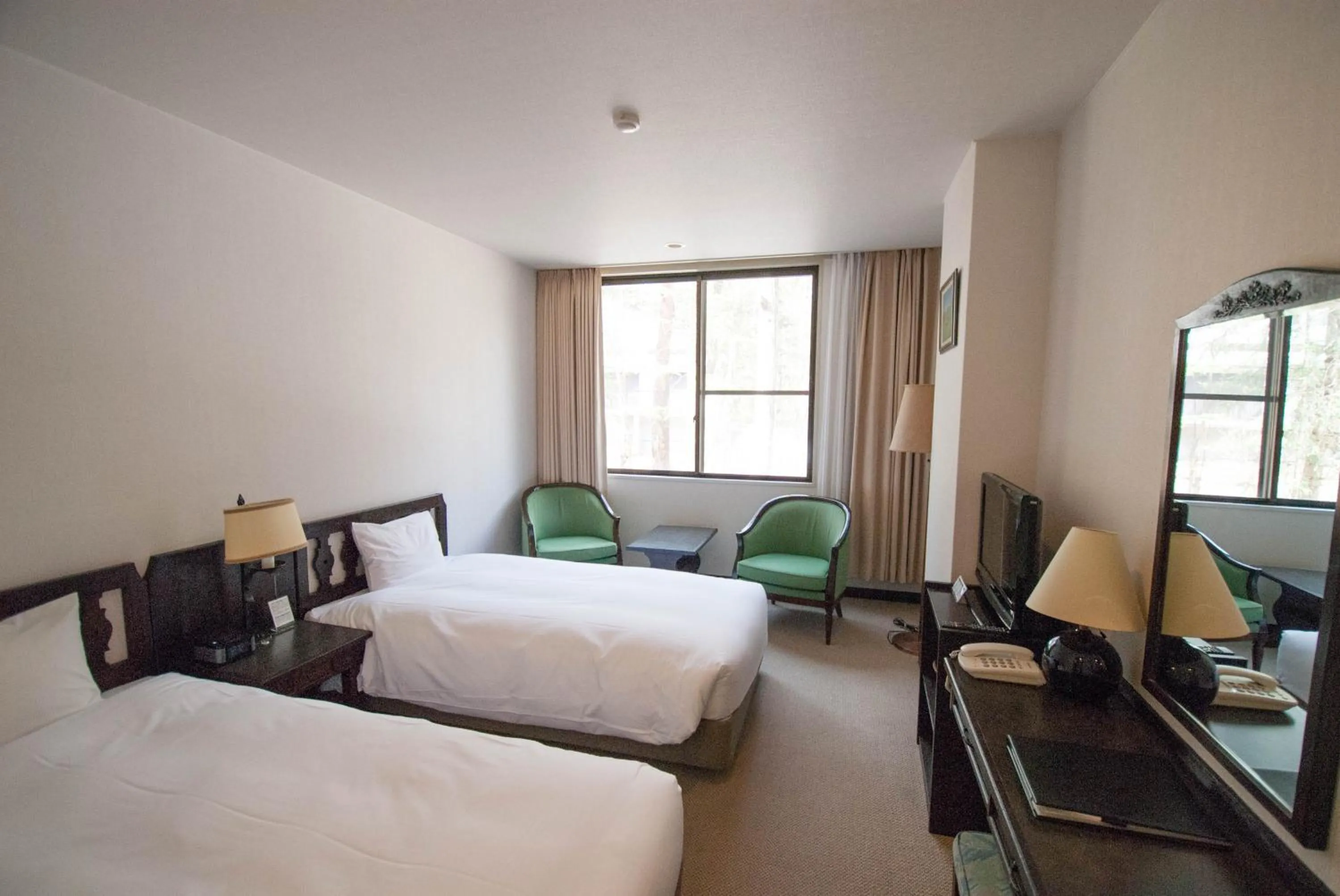 Bed in Hakuba Mominoki Hotel