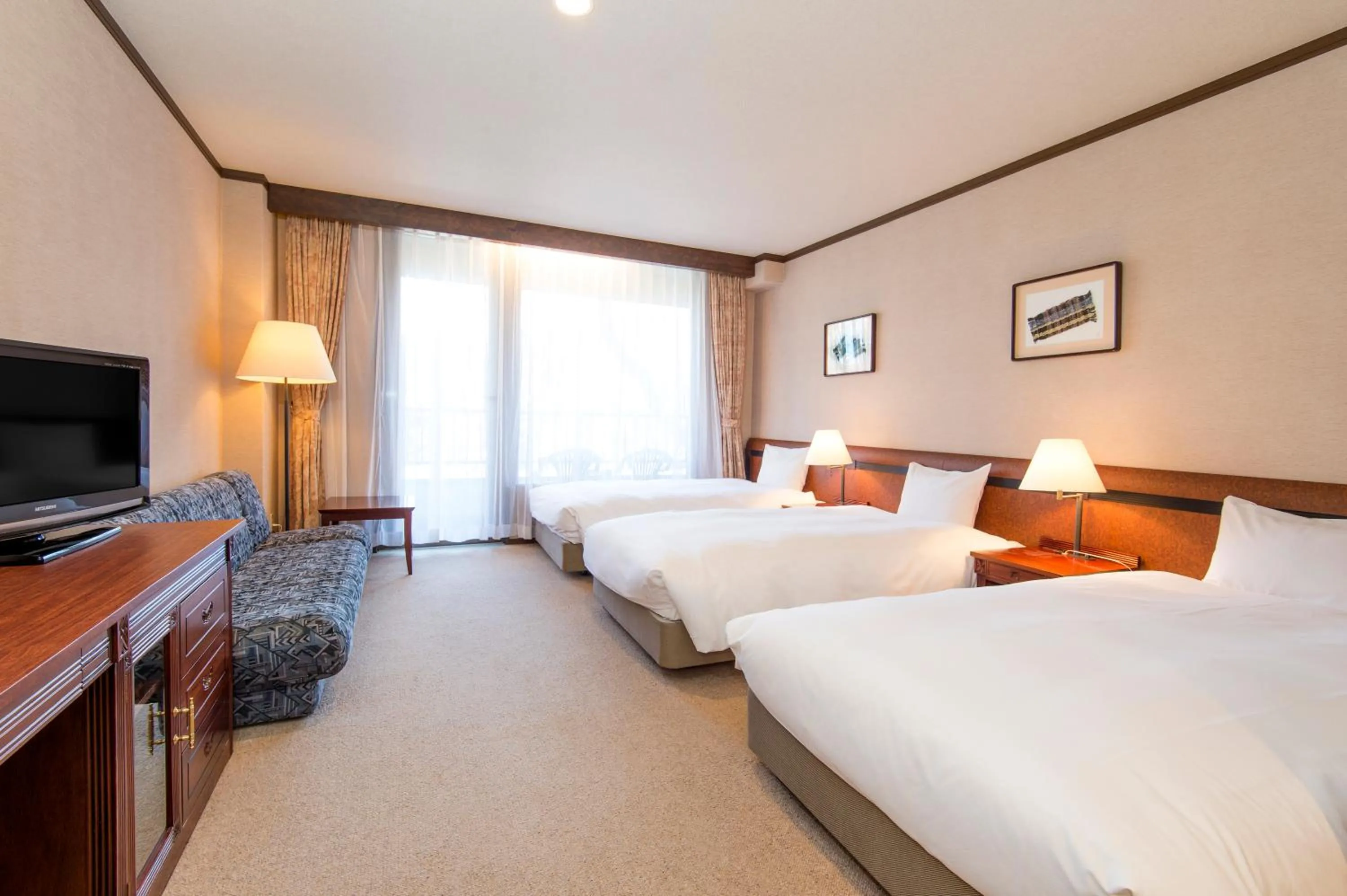 Bed in Hakuba Mominoki Hotel