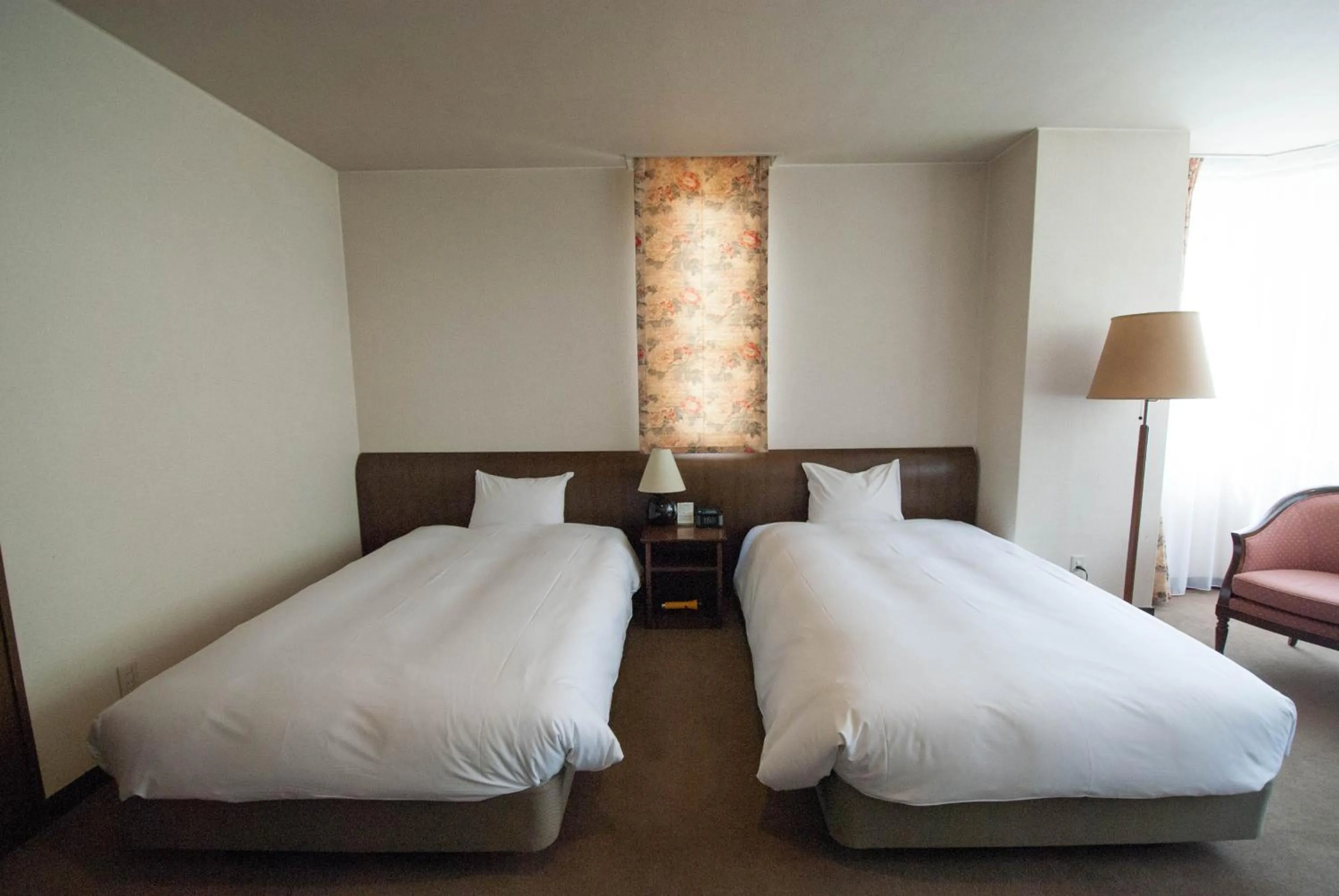 Bed in Hakuba Mominoki Hotel