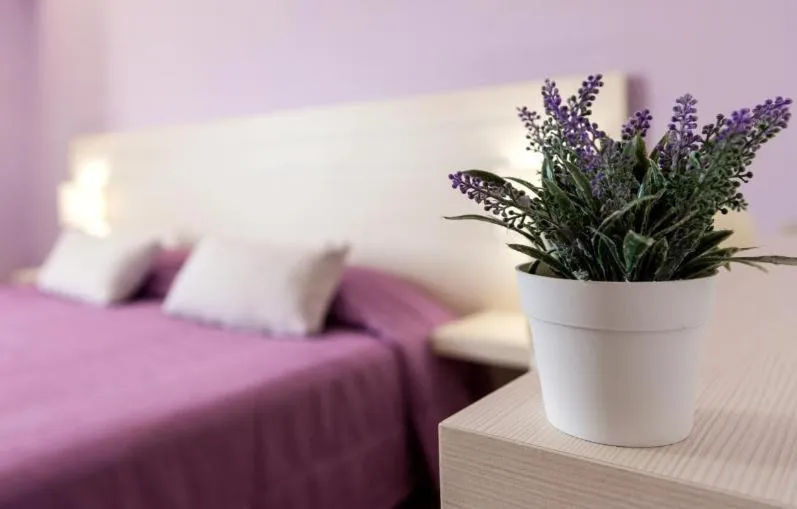 Bed in Terinikos Sunny Garden Hotel & Junior Suites