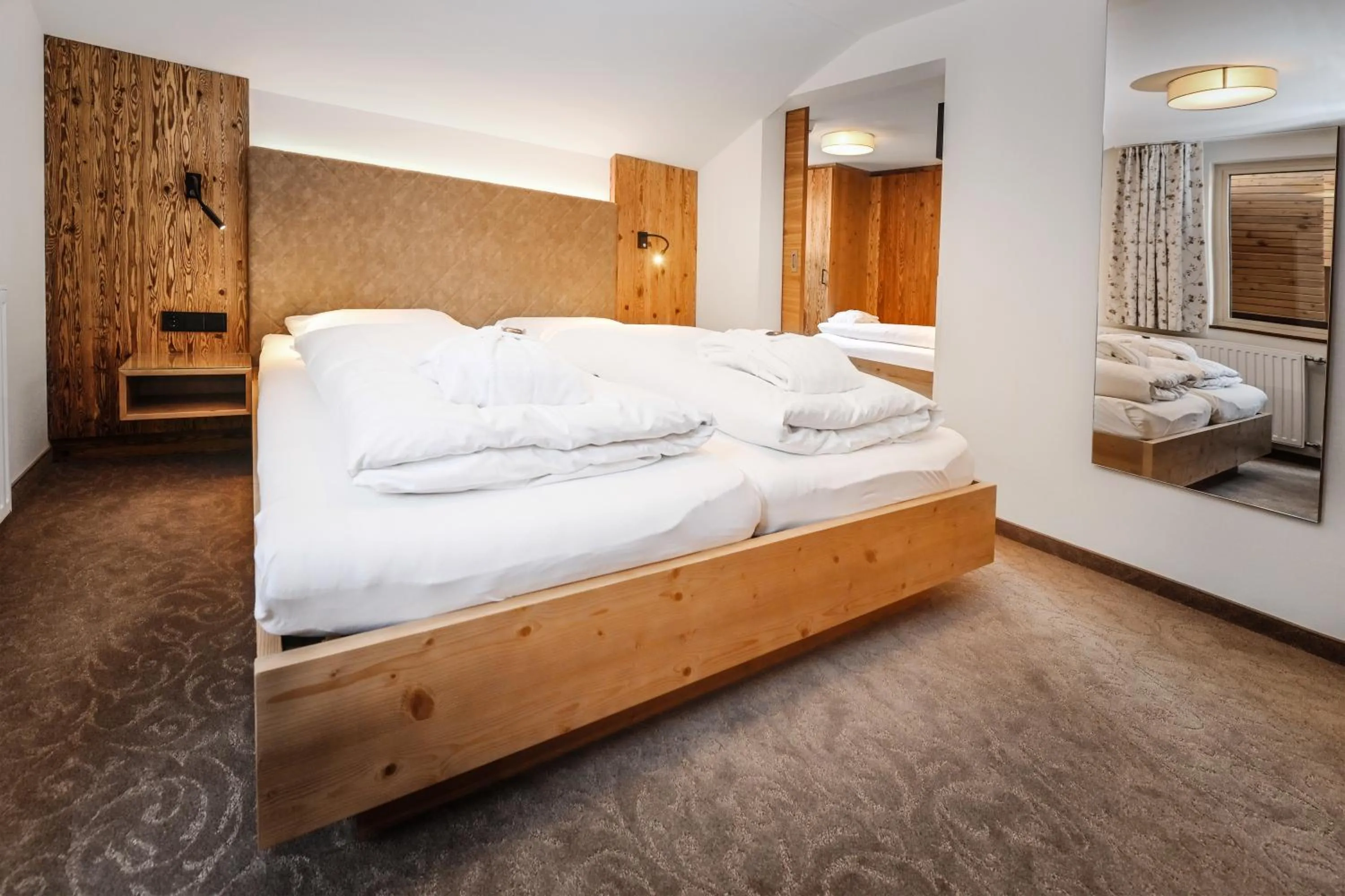 Photo of the whole room, Bed in Hotel Alpenfeuer Montafon