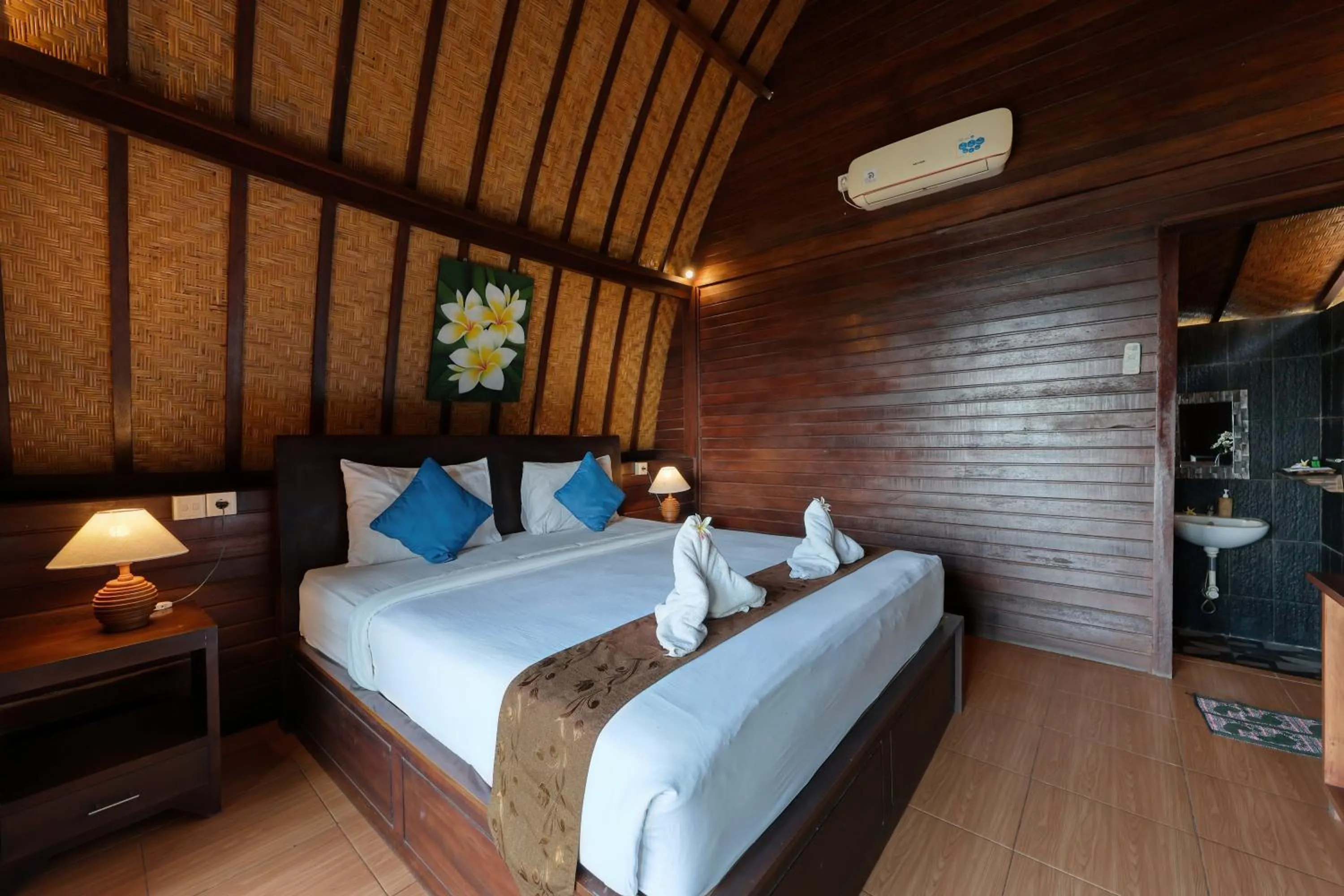 Bed in Bataran Garden Cottage