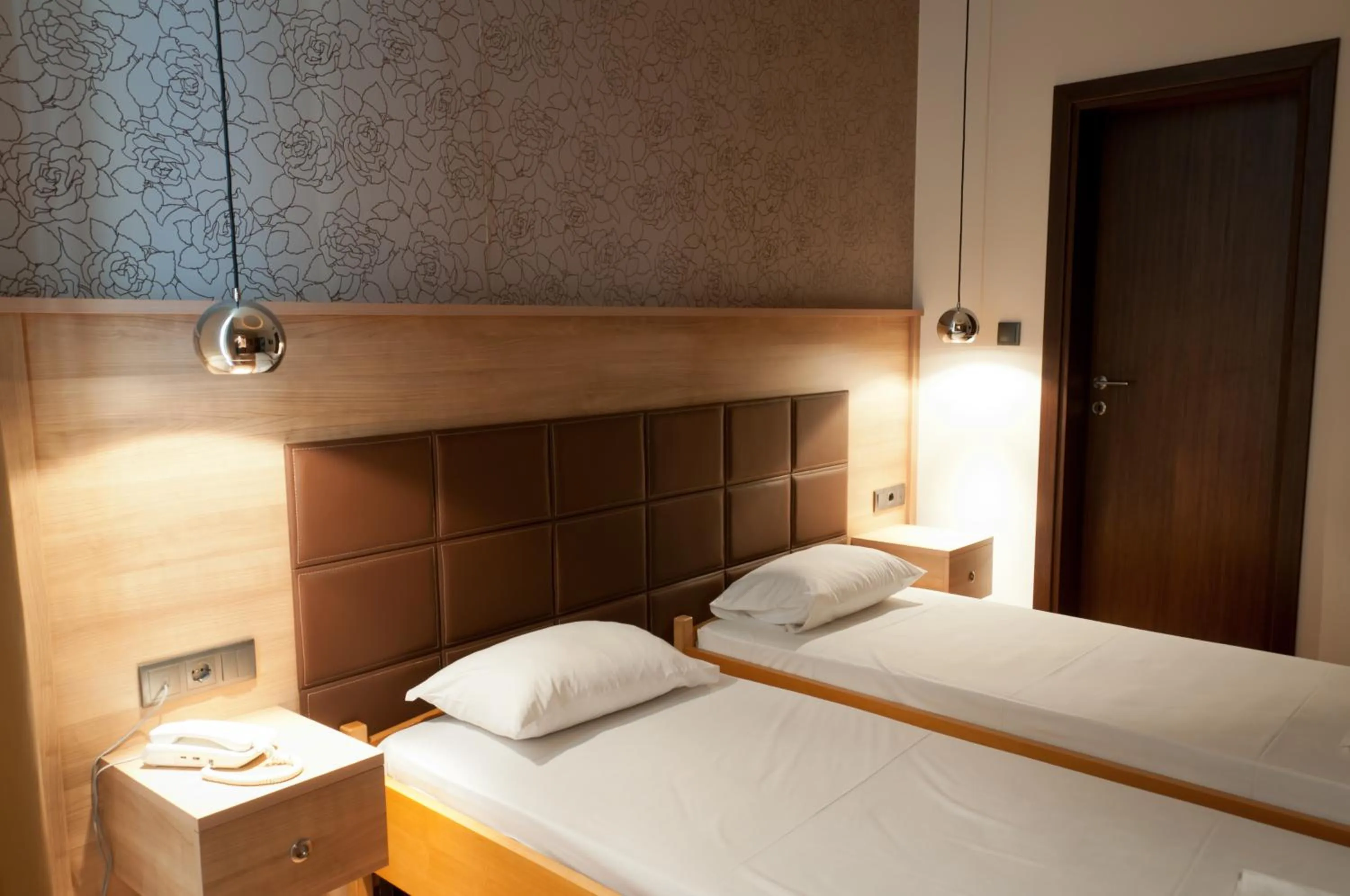 Bed in Metropolis Hotel