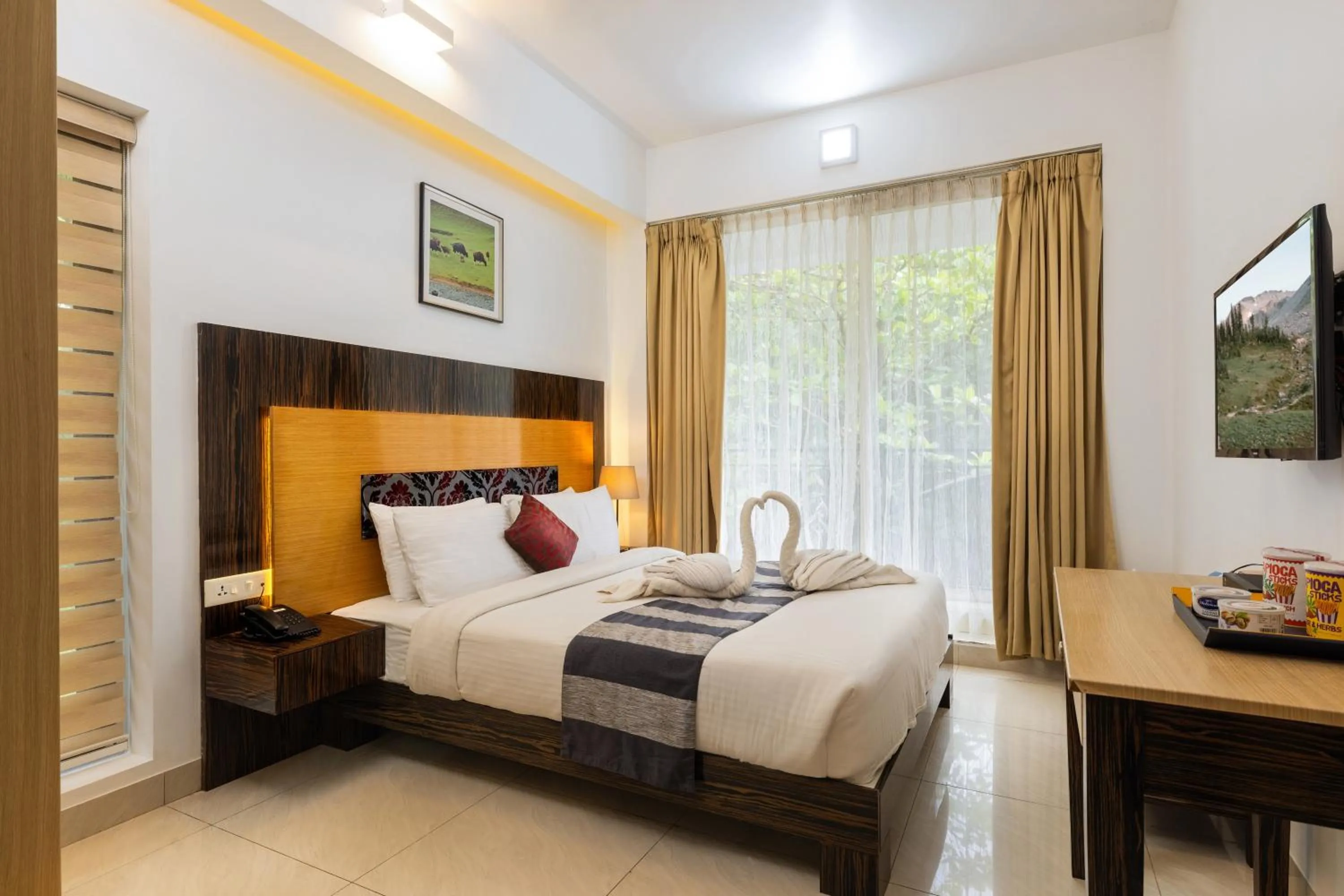 Bed in Casa Rio Resorts Athirappilly