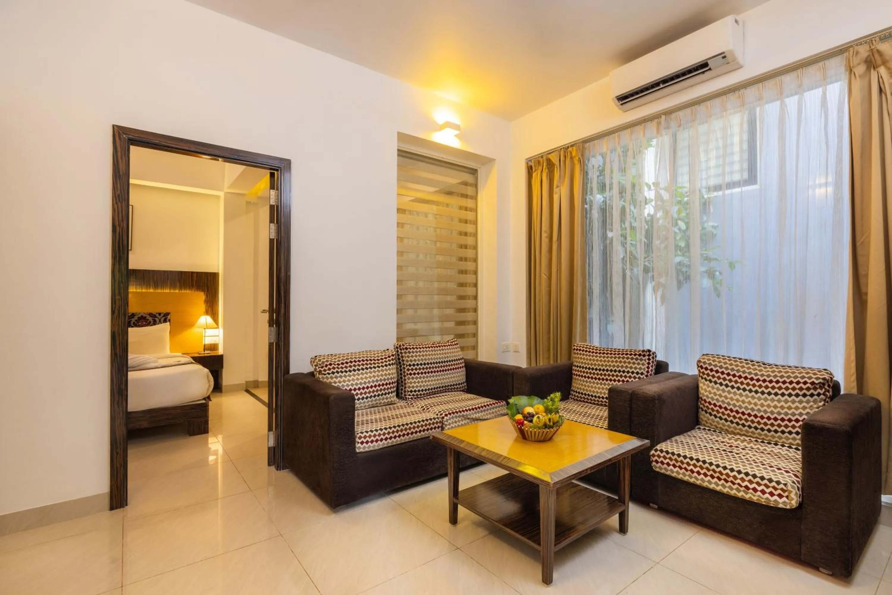 Living room, Bed in Casa Rio Resorts Athirappilly