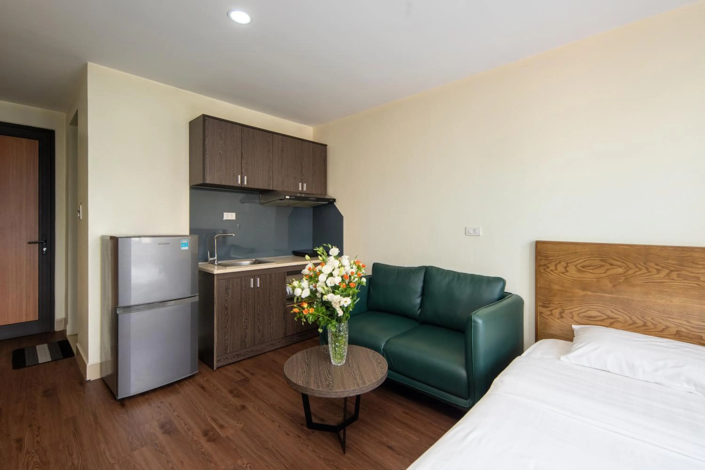 Kitchen or kitchenette, Bed in Granda Hanoi Hotel & Apartment