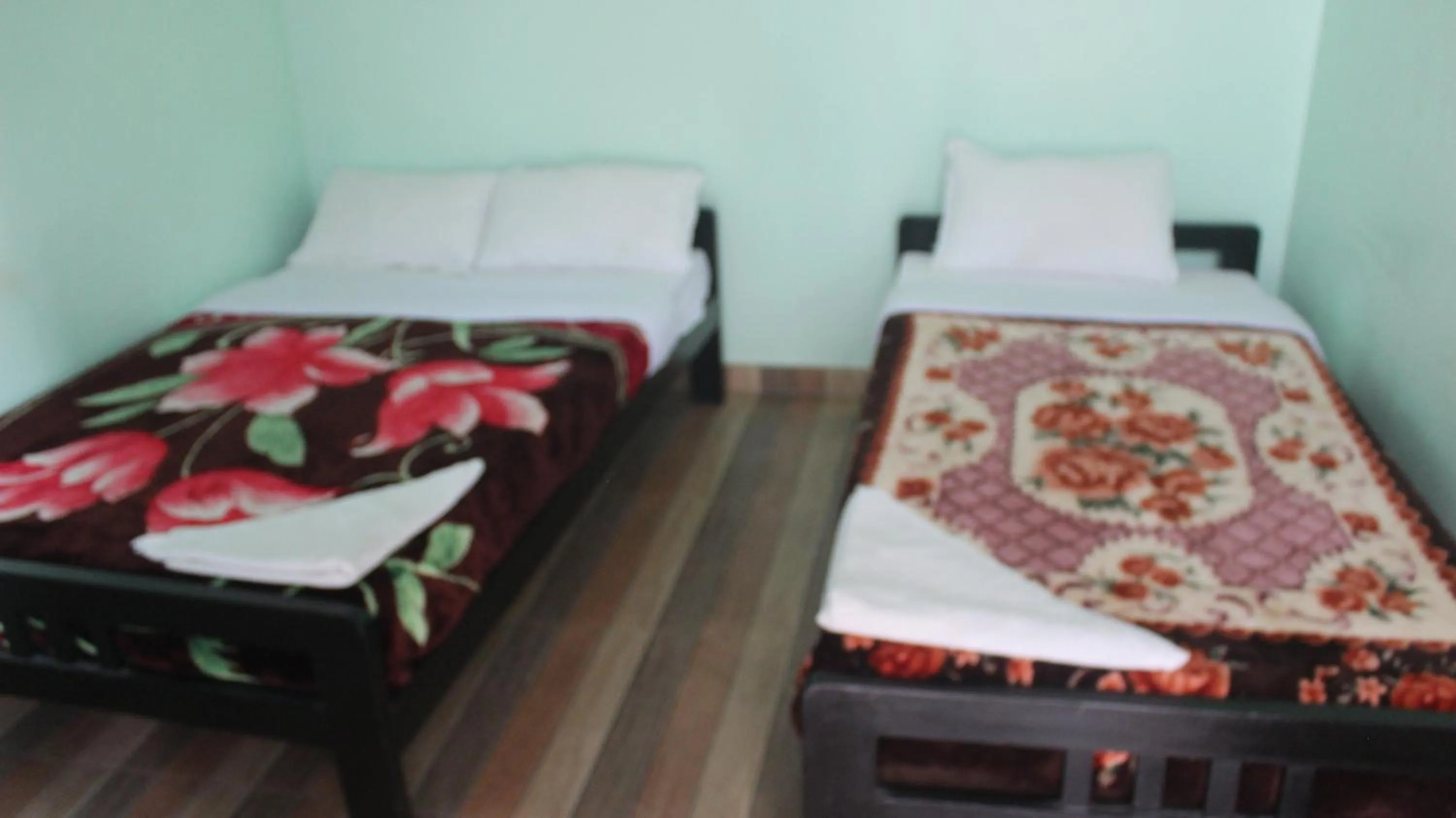 Bed in Harry Guest House & Restaurant
