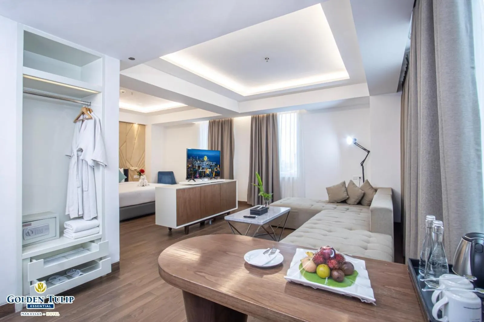 Living room, Bed in Golden Tulip Essential Makassar