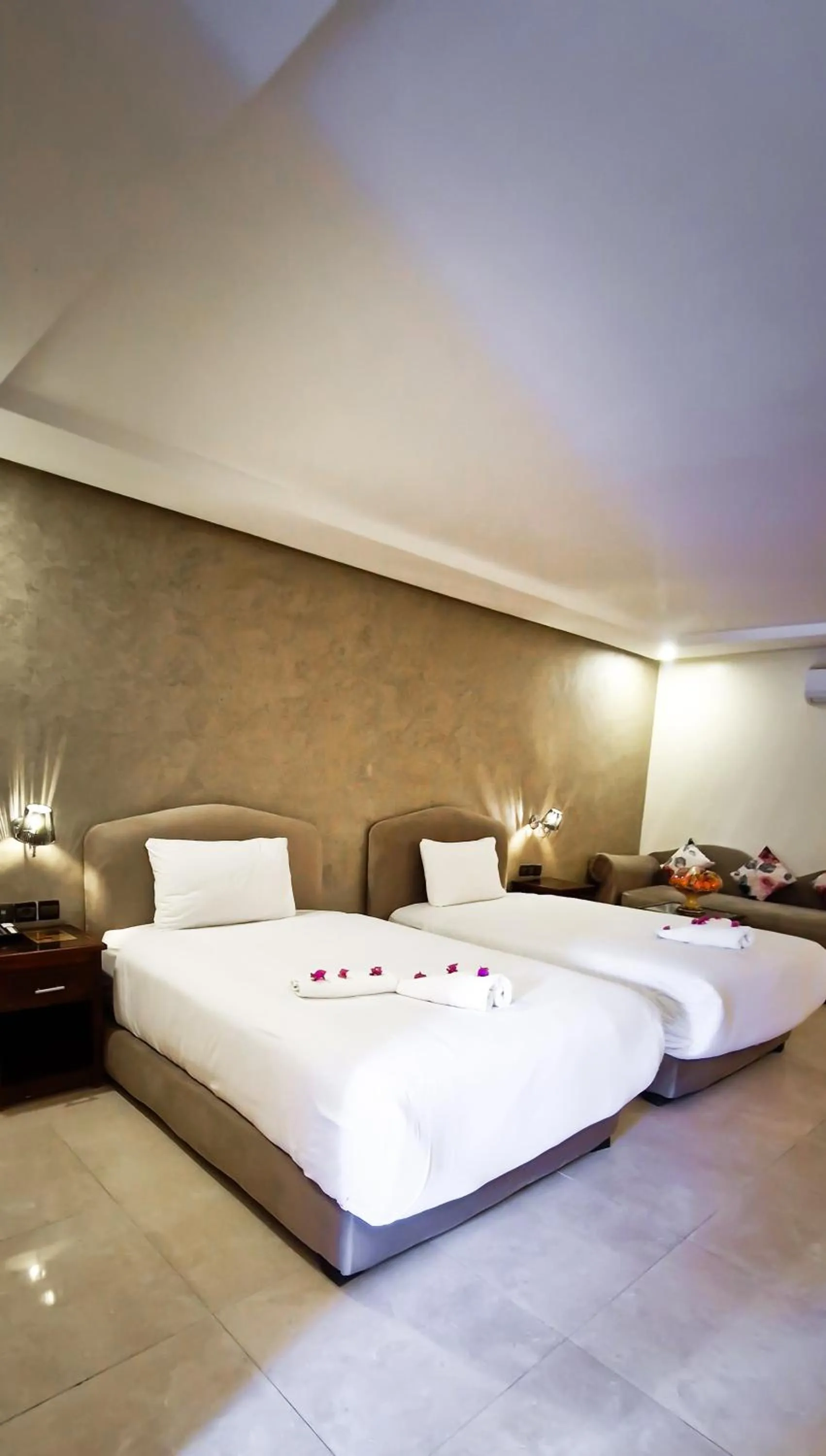 Bed in Palm's Hotel Club