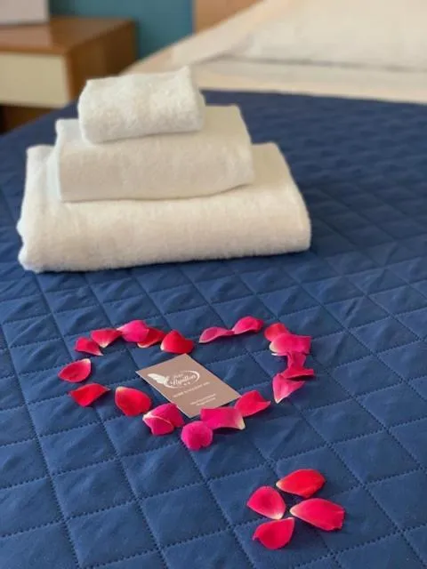 Bed in Albergo Papillon