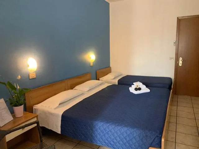 Bed in Albergo Papillon