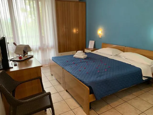 Bed in Albergo Papillon