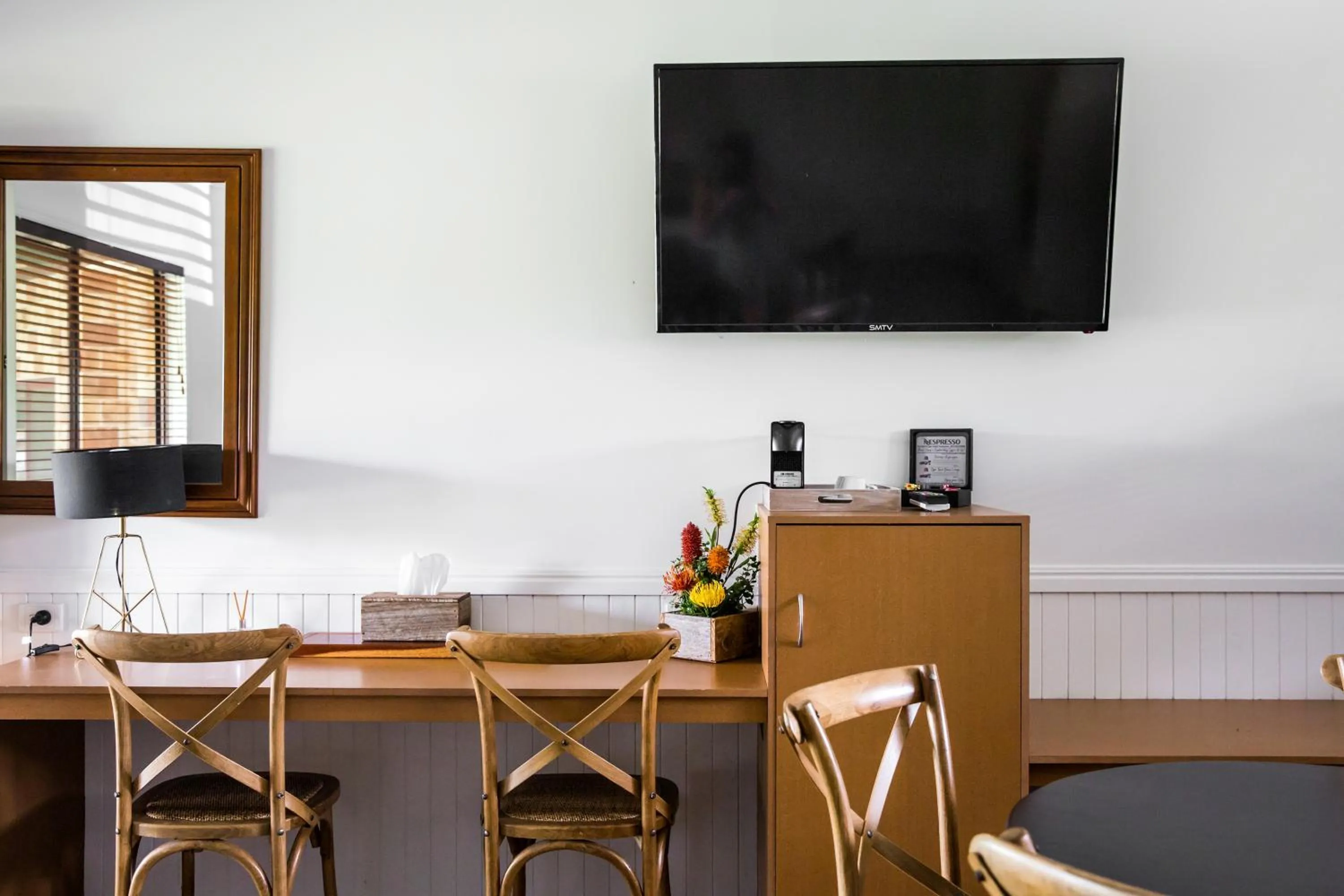 Communal lounge/ TV room in The Bearded Dragon Boutique Hotel