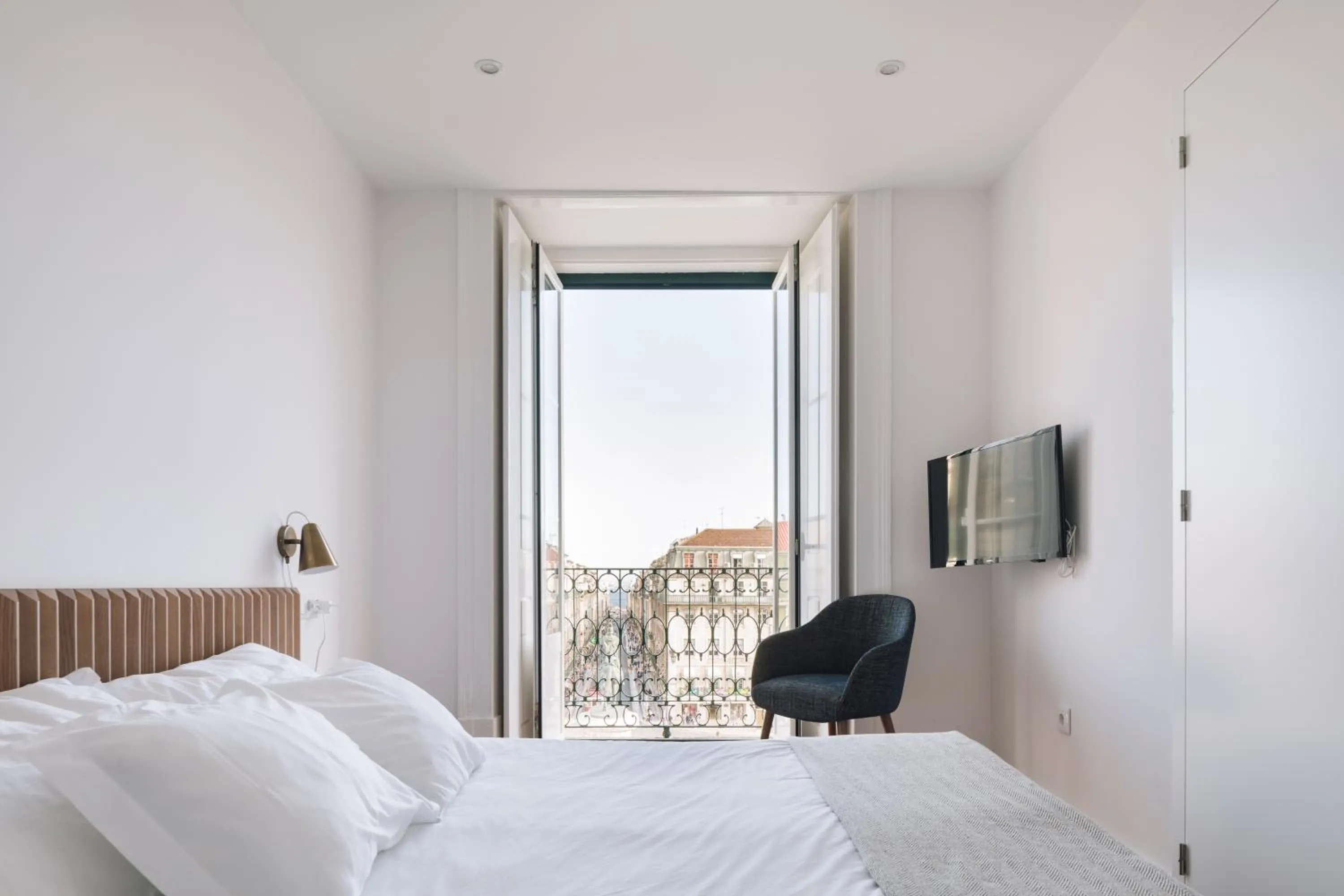 Bed in The Visionaire Apartments