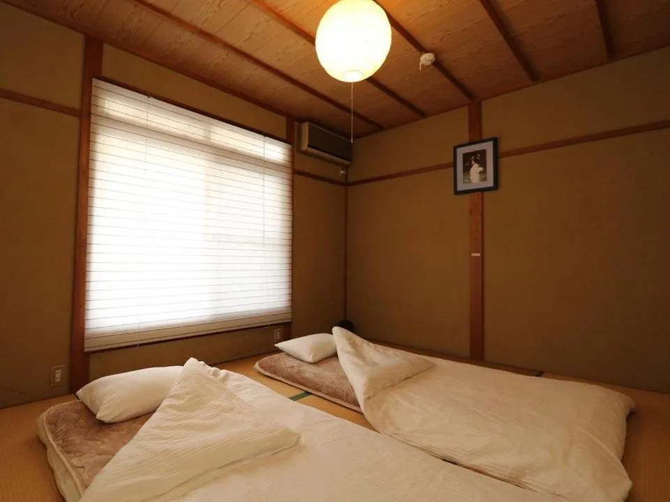 Bed in Guesthouse Kyoto-Yamashina
