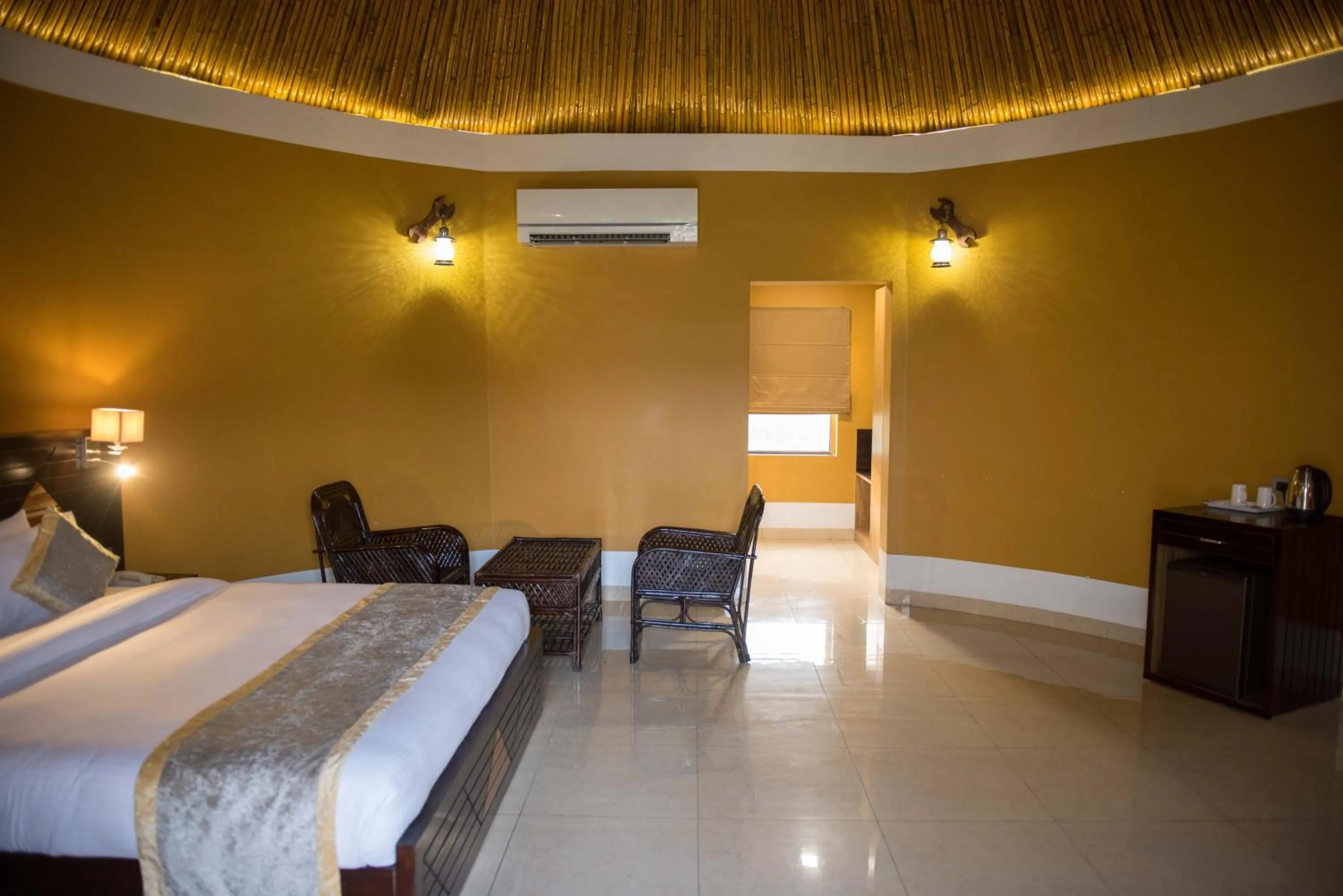 Seating area, Bed in Sun Hotel and Resort, Mount Abu