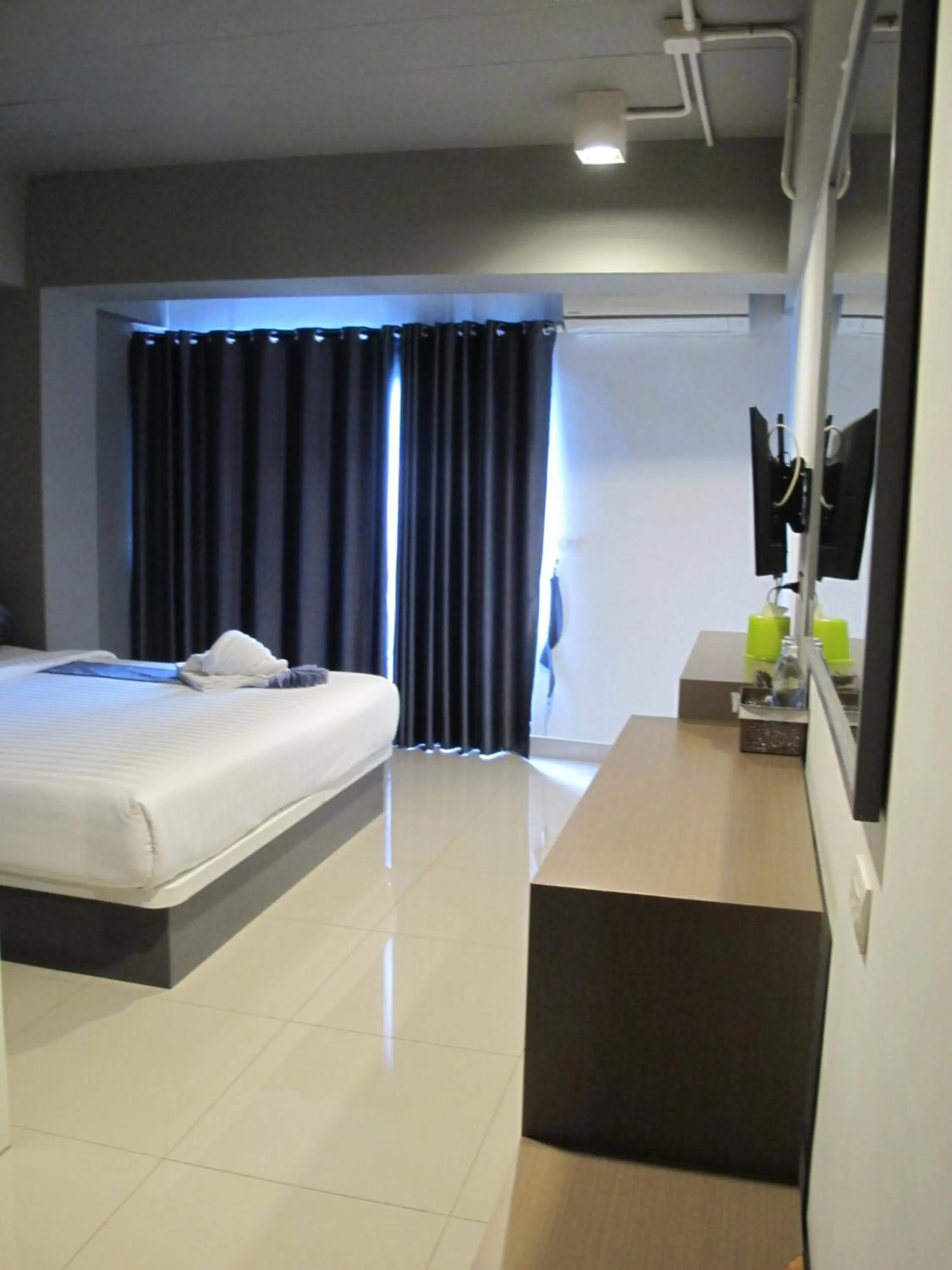 Bed in Suvarnabhumi Oriental Resort