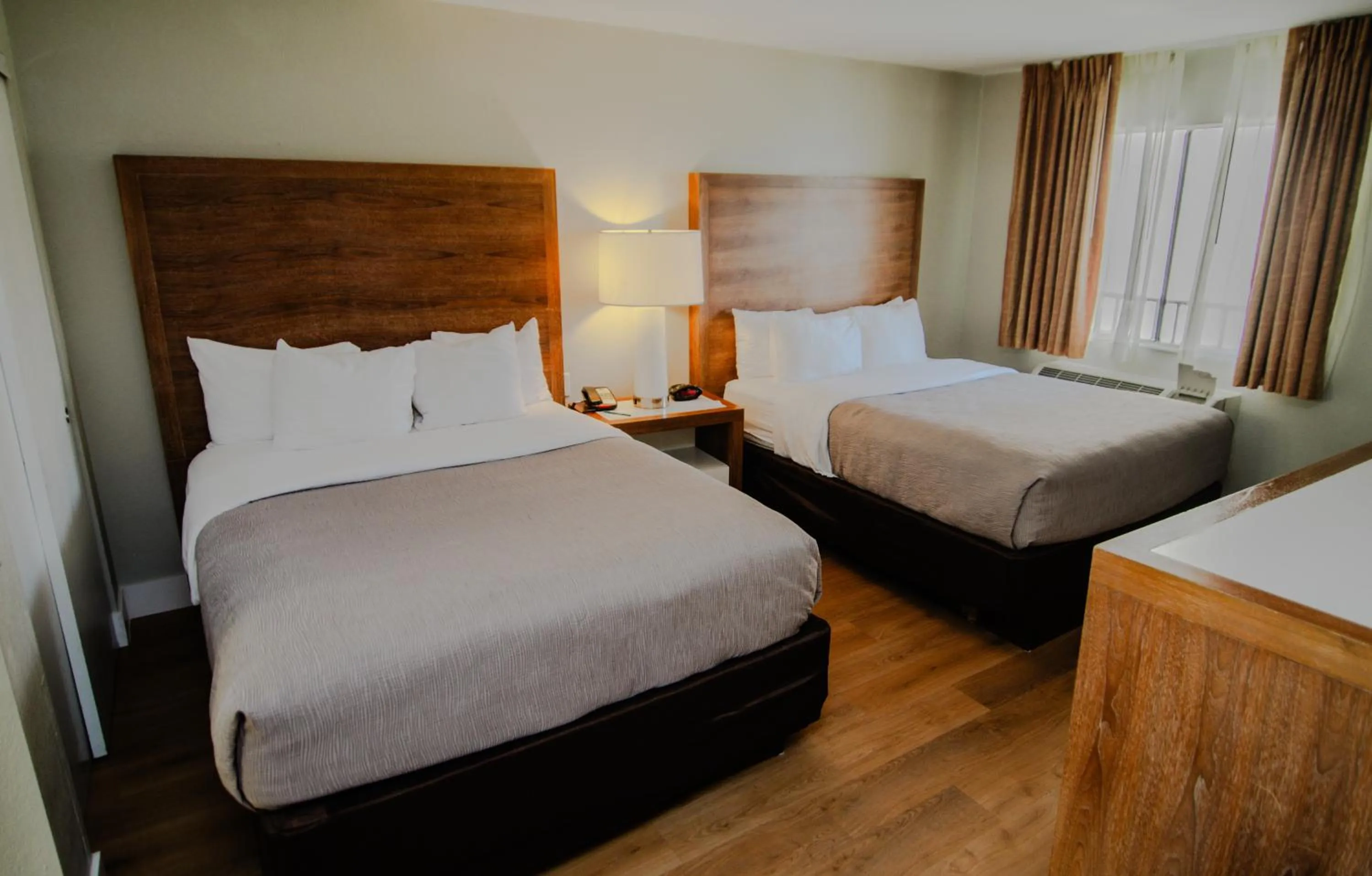 Bed in Quality Inn & Suites By the Parks