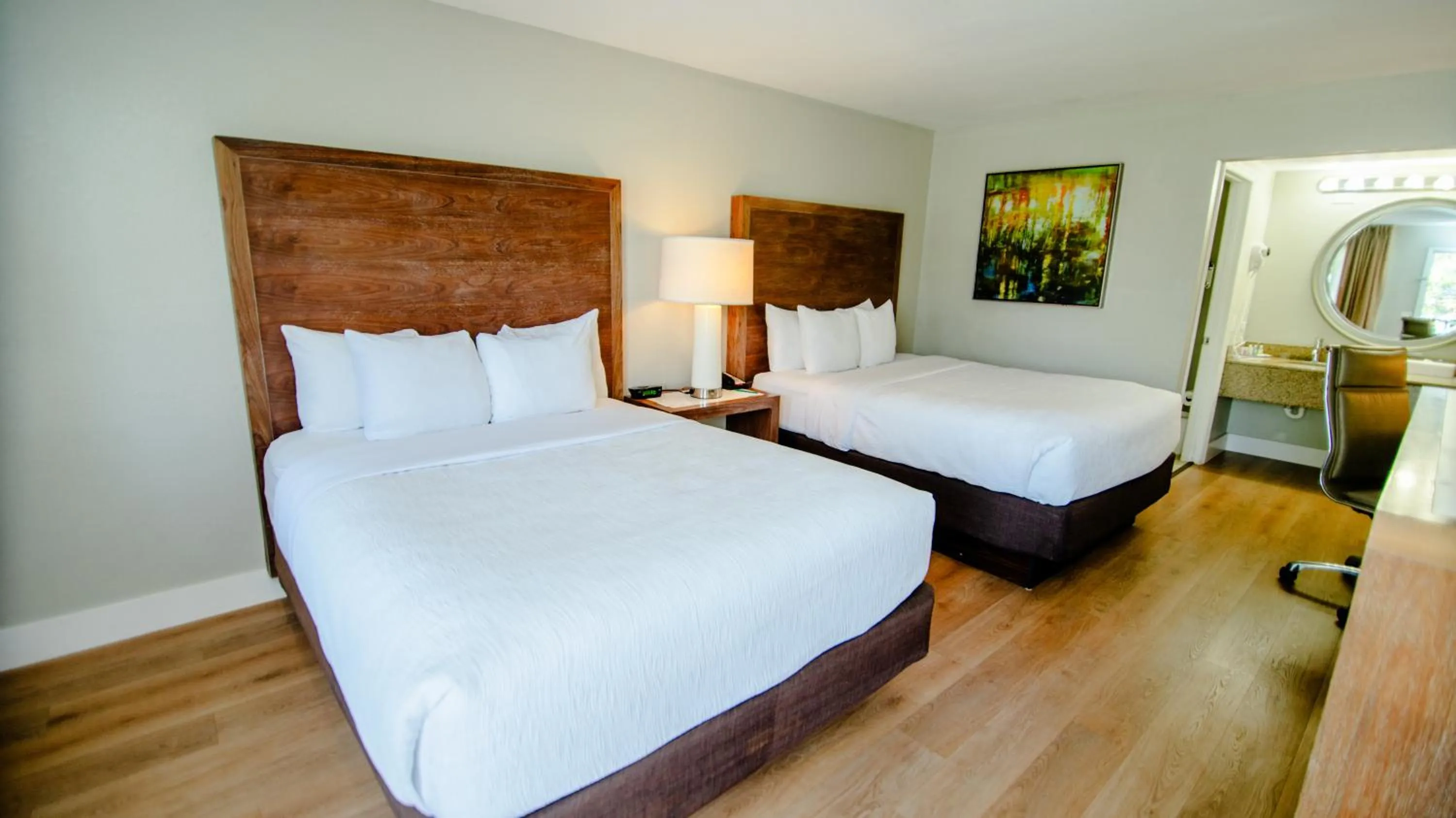 Bed in Quality Inn & Suites By the Parks