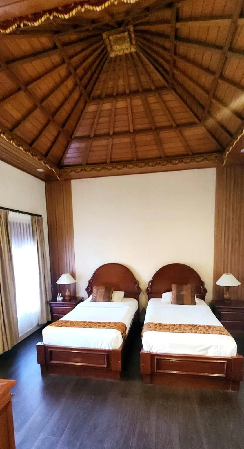 Bed in Stana Puri Gopa Hotel