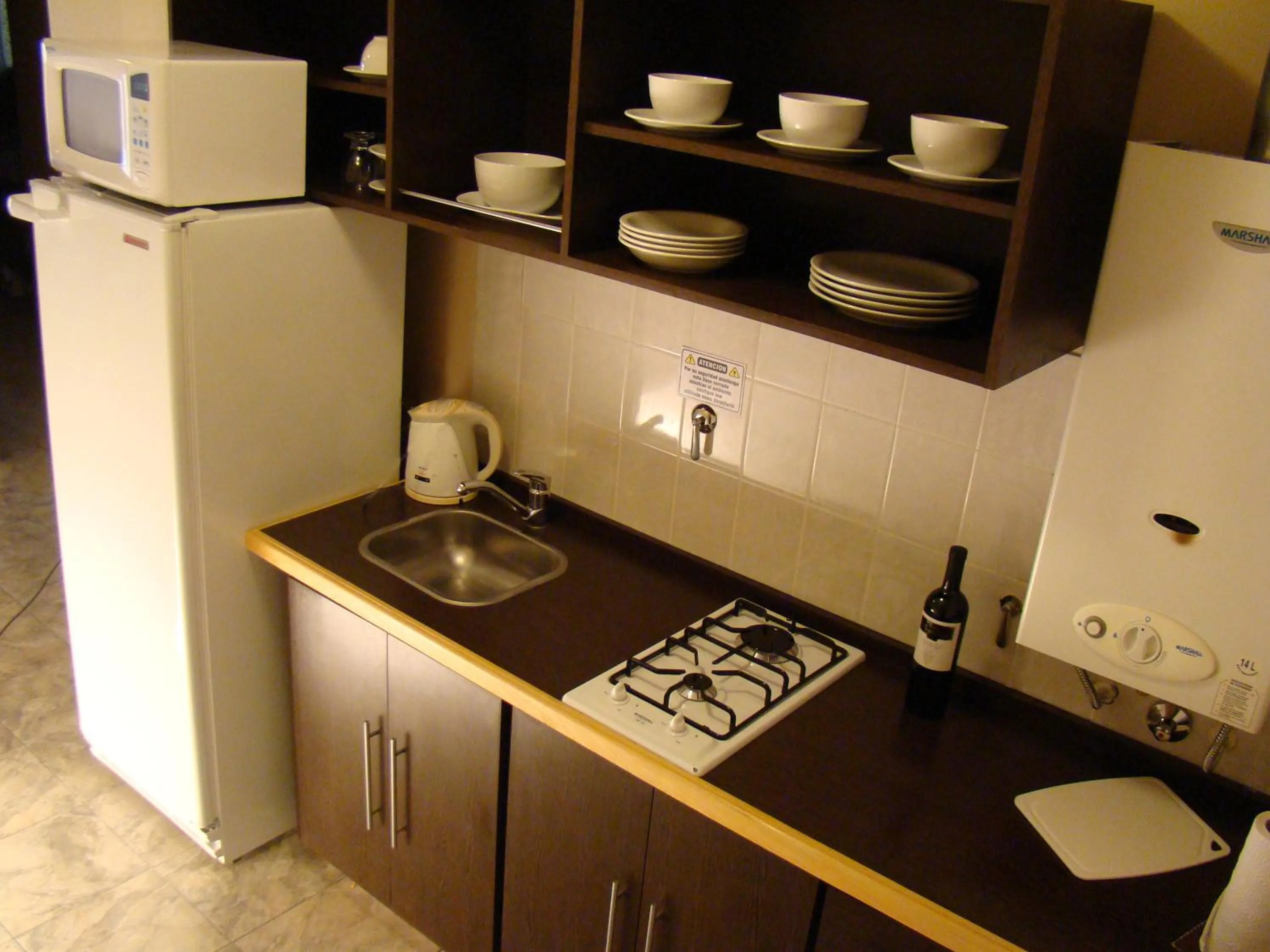 Kitchen or kitchenette in Vecchia Terra Apart Hotel
