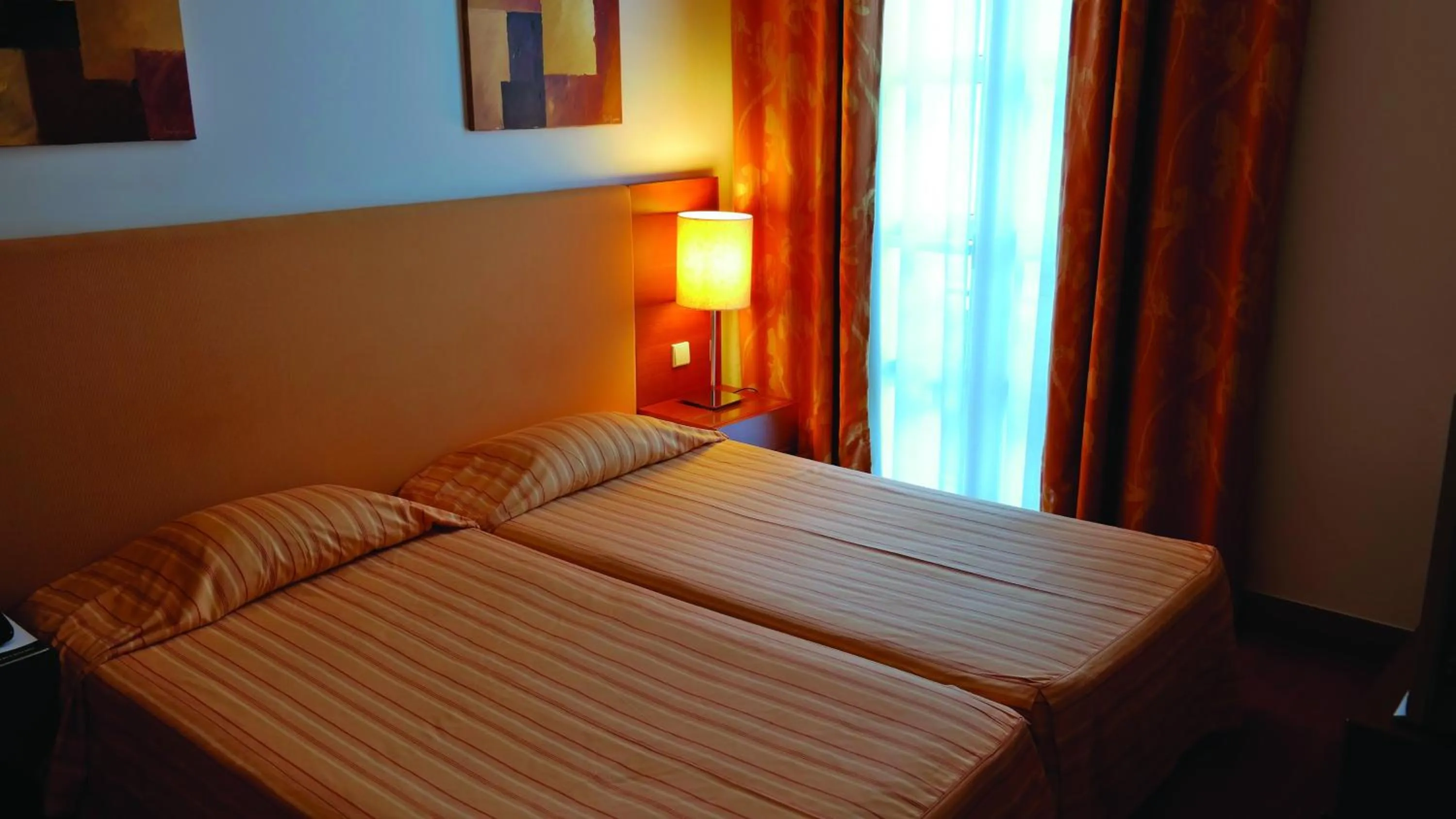 Bed in Hotel Apartamentos Geres Ribeiro