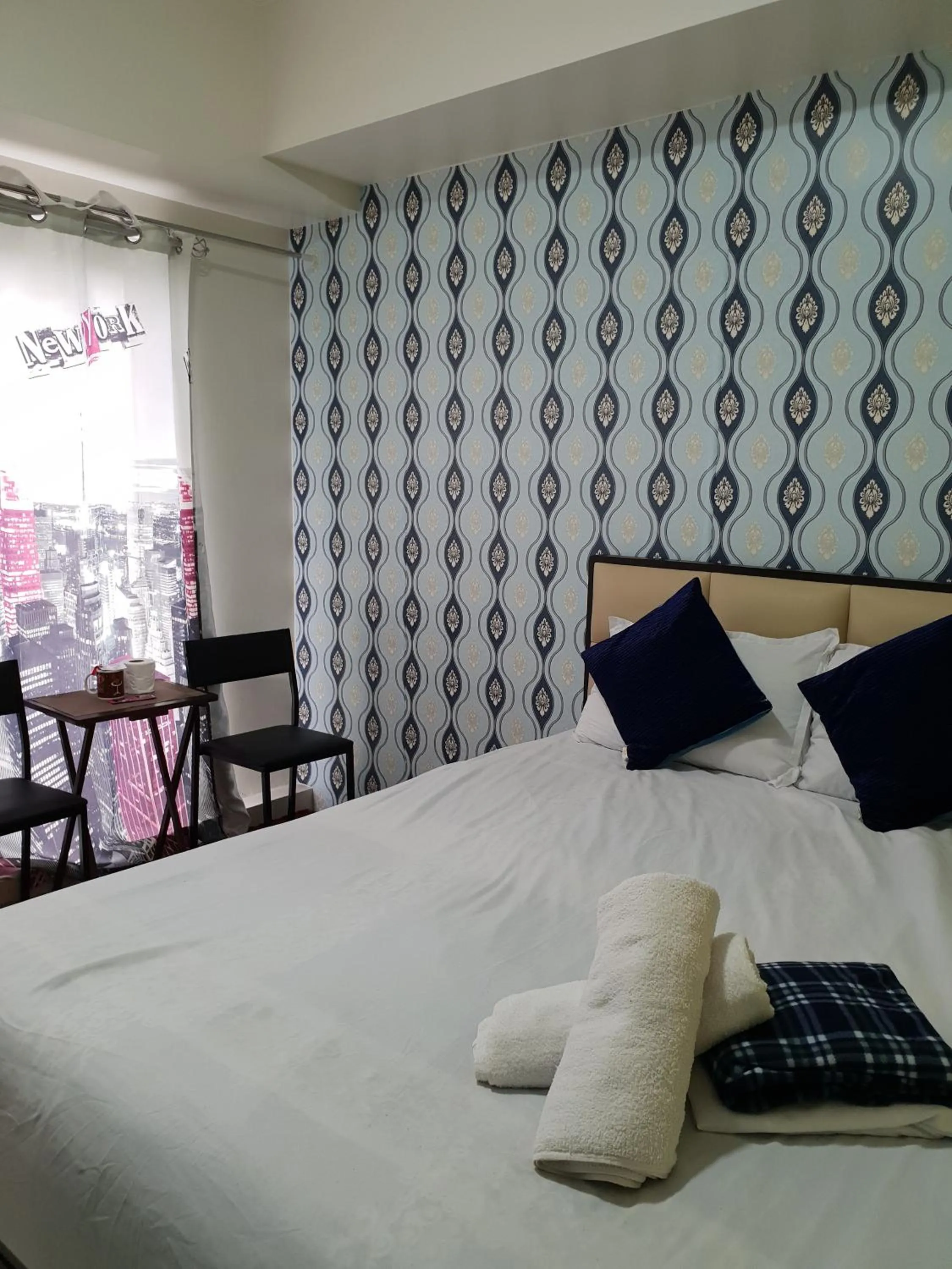 Bed in Wind Residences by Bea and RM