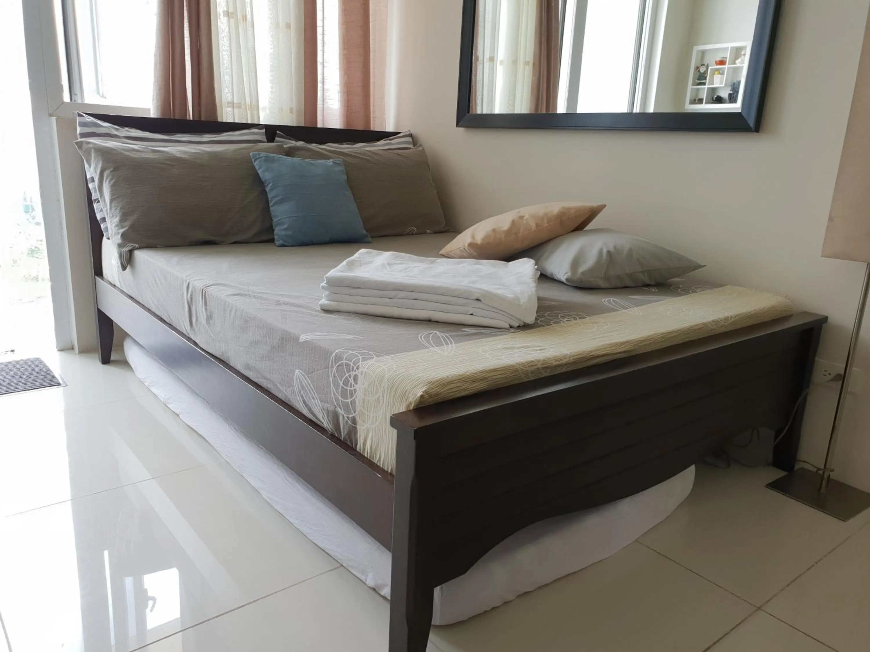 Bed in Wind Residences by Bea and RM