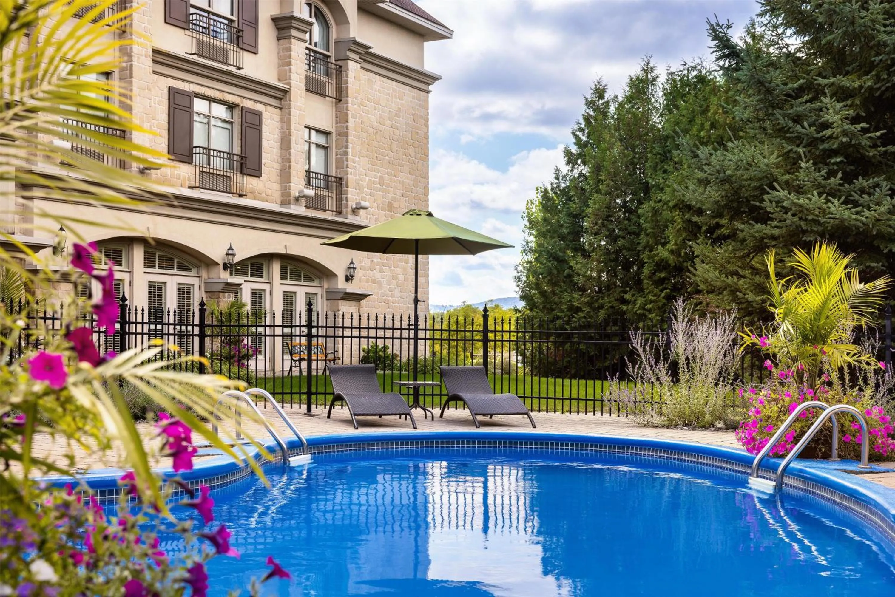 Pool view in Hotel Vallea Bromont, Tapestry Collection by Hilton