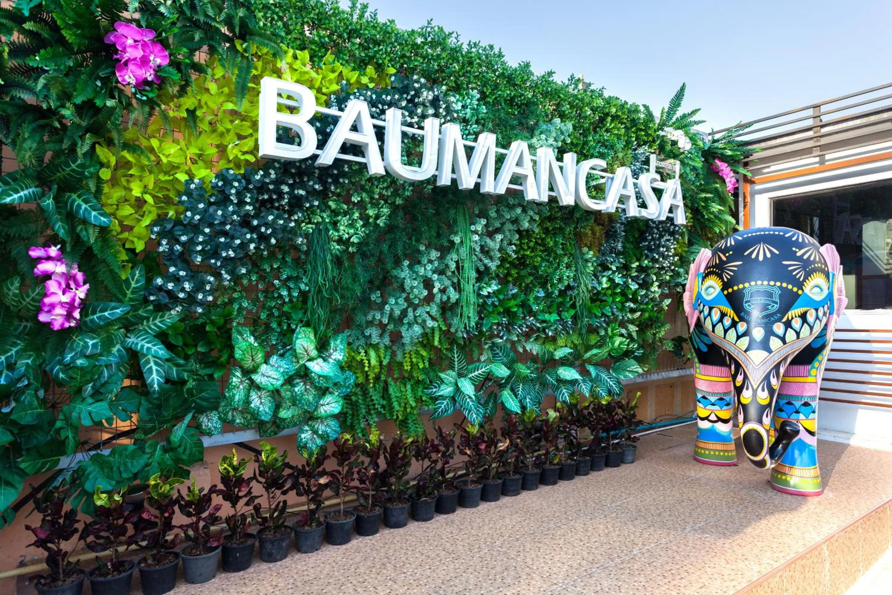 Property logo or sign in Baumancasa Beach Resort