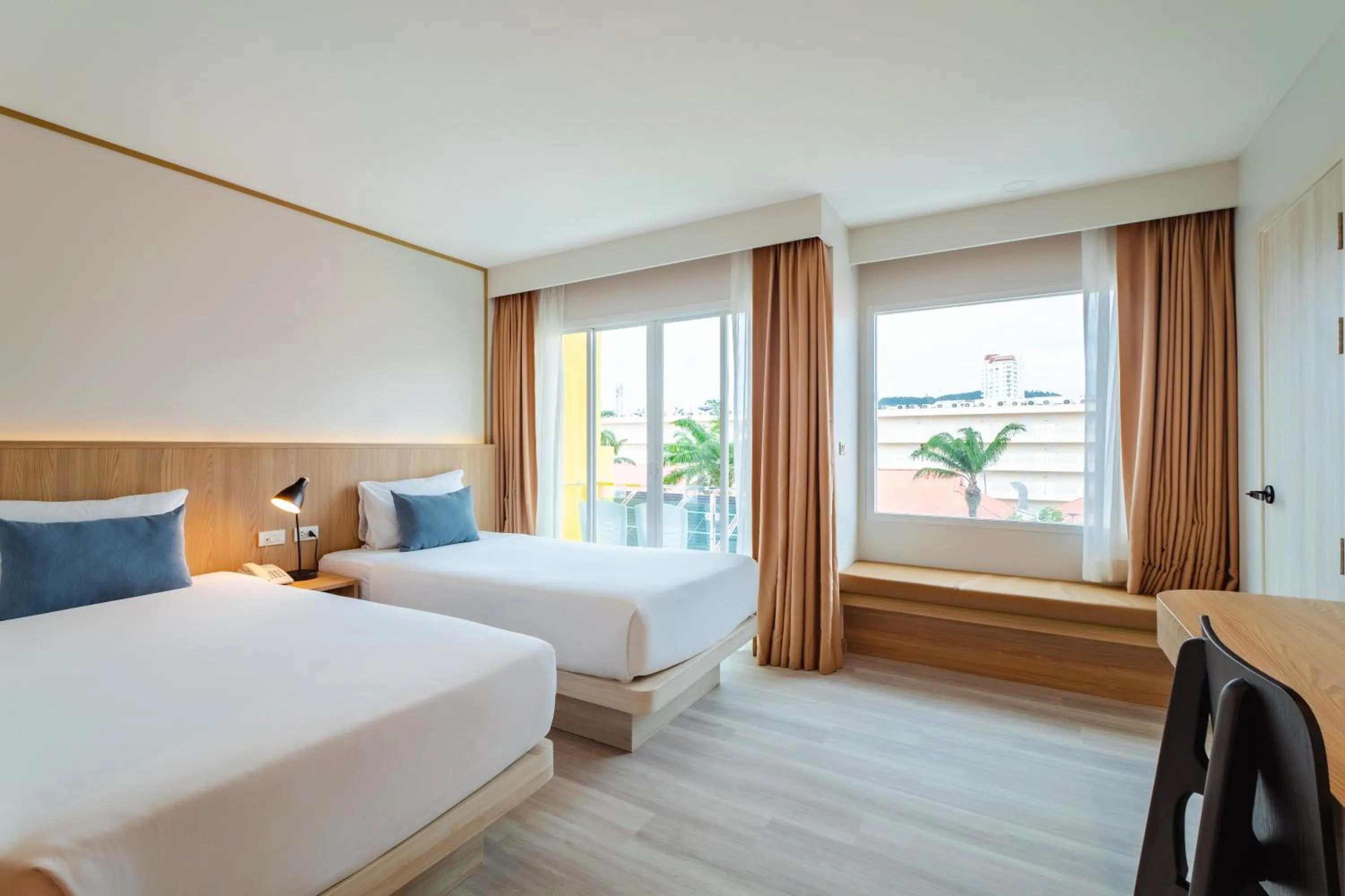 Bed in Baumancasa Beach Resort