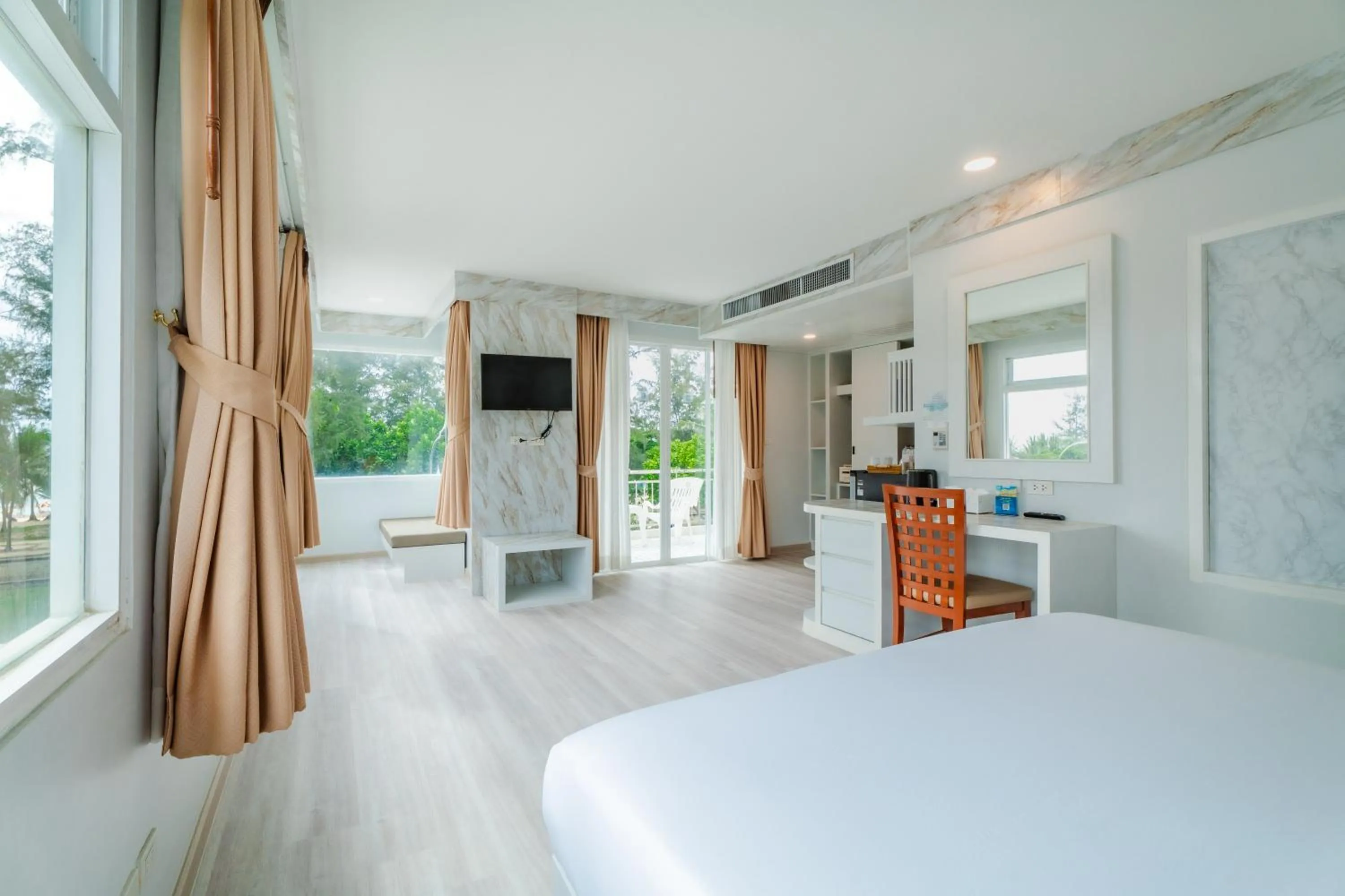 Photo of the whole room, Bed in Baumancasa Beach Resort