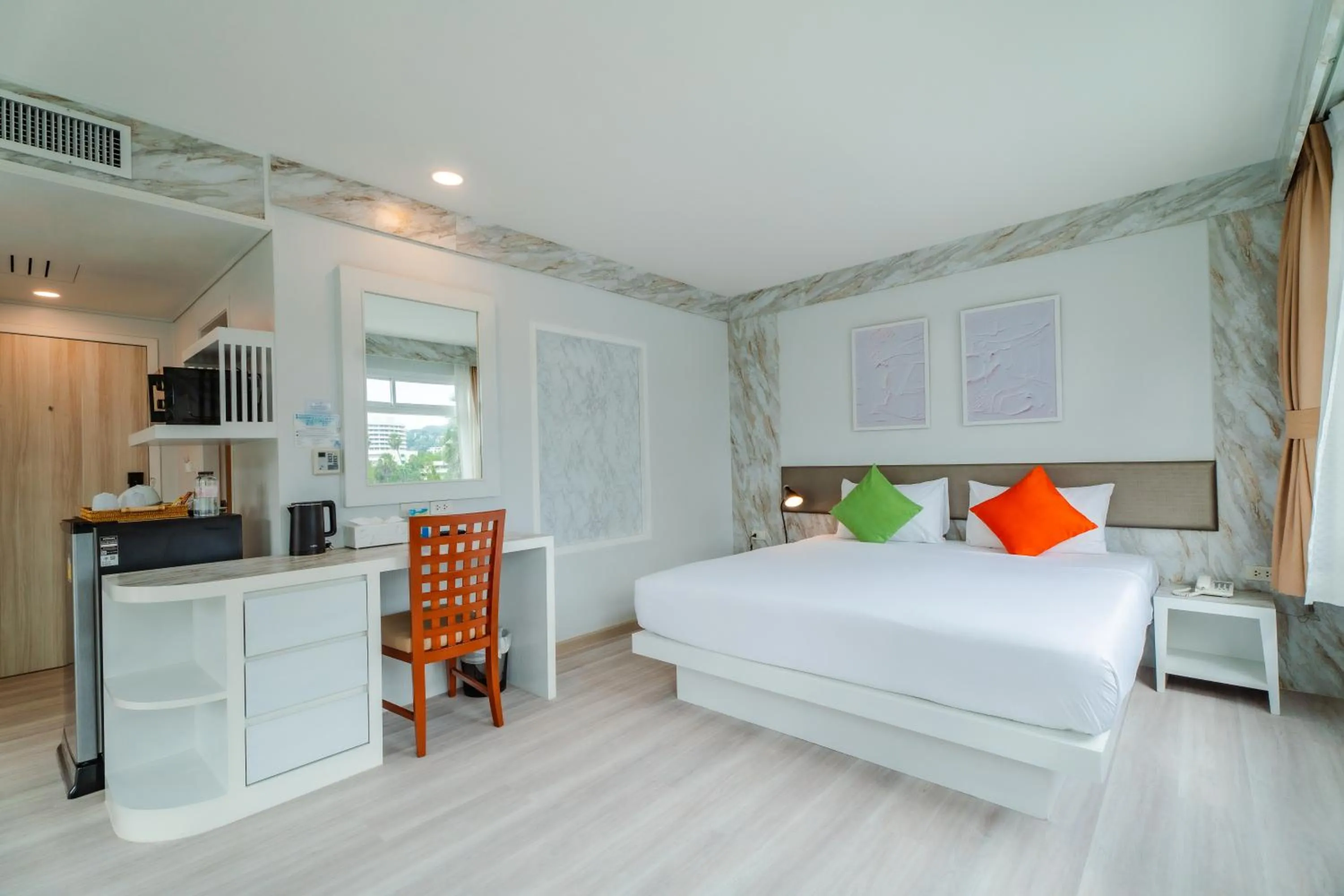 Bed in Baumancasa Beach Resort