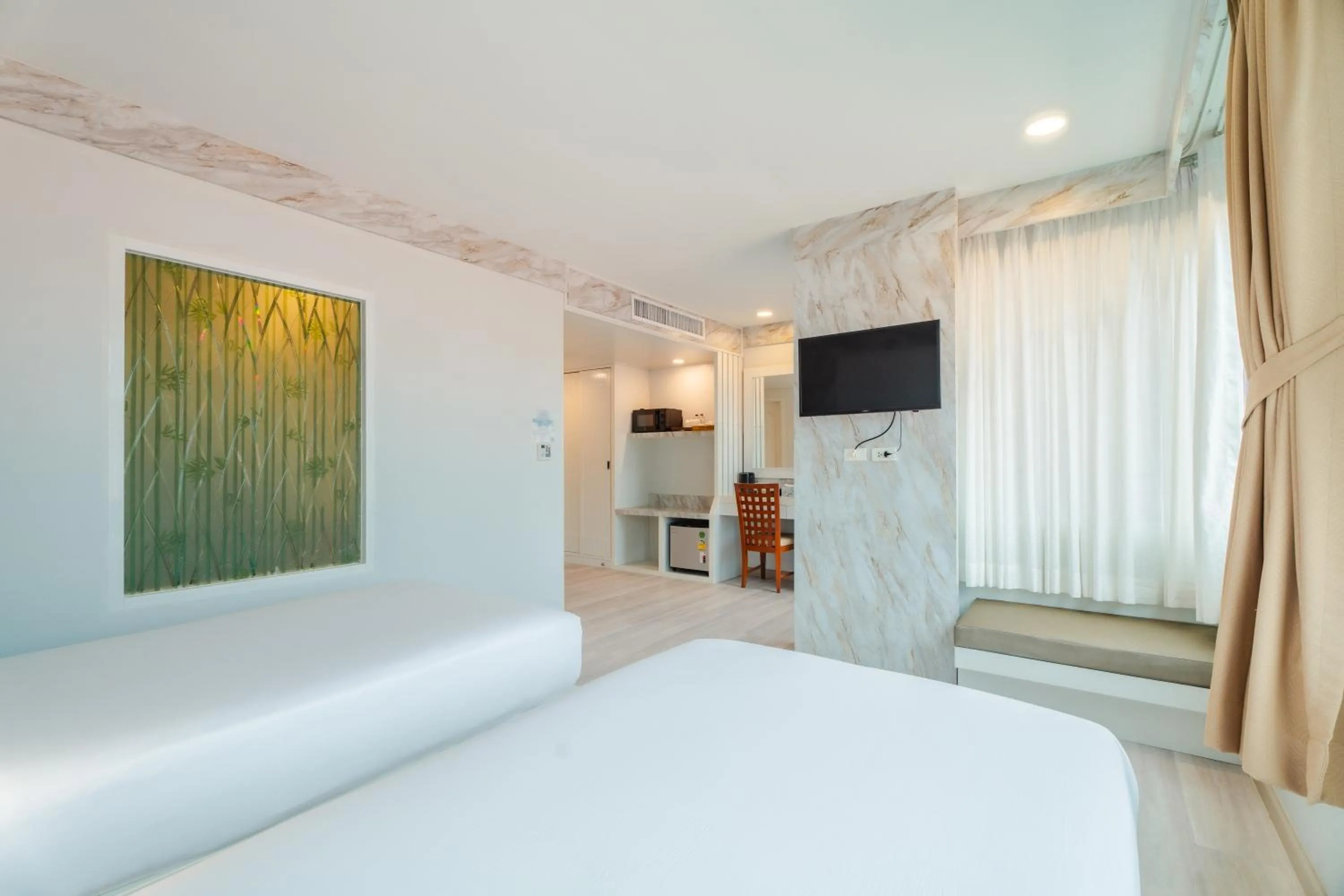 Photo of the whole room, Bed in Baumancasa Beach Resort