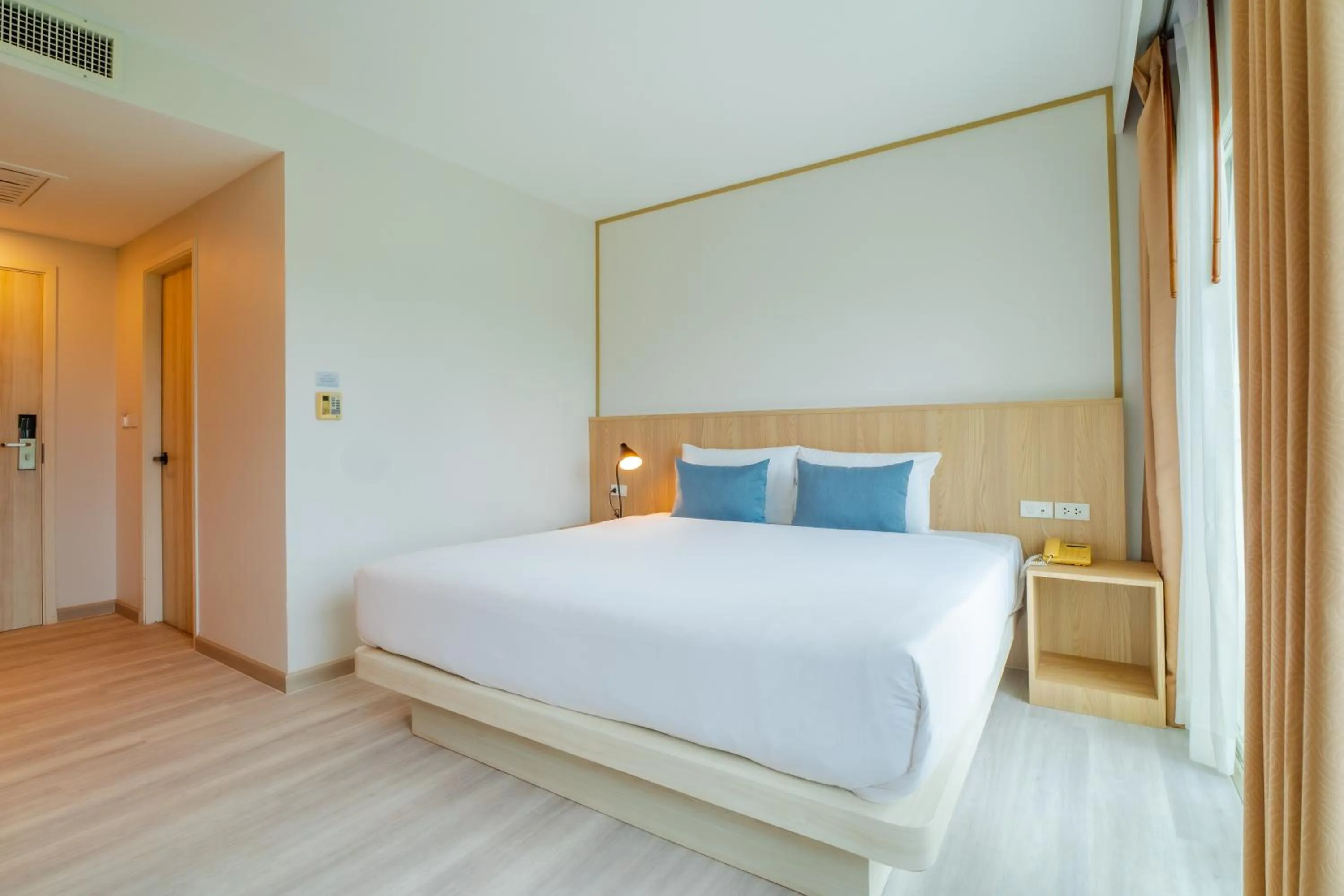 Bed in Baumancasa Beach Resort