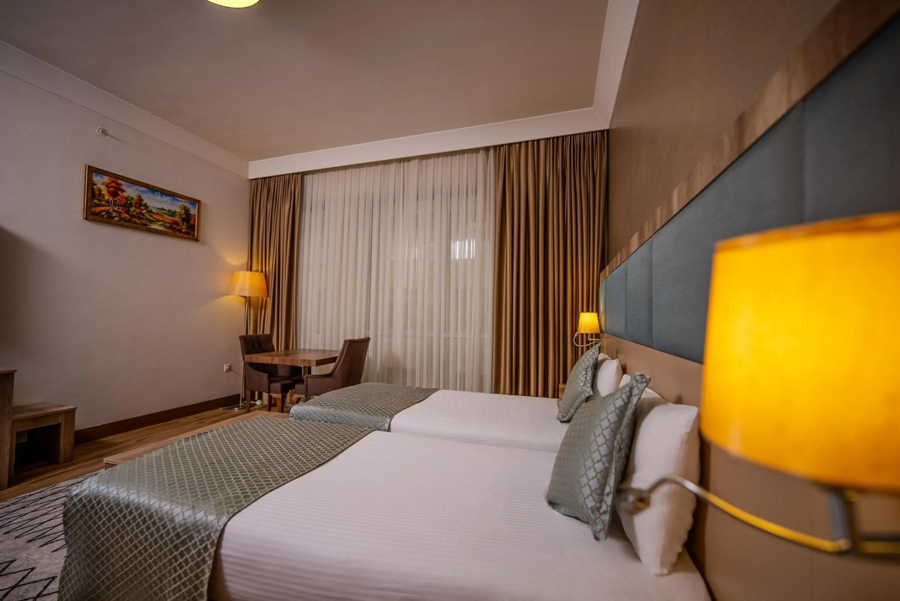 Bed in Mari Suites Hotel