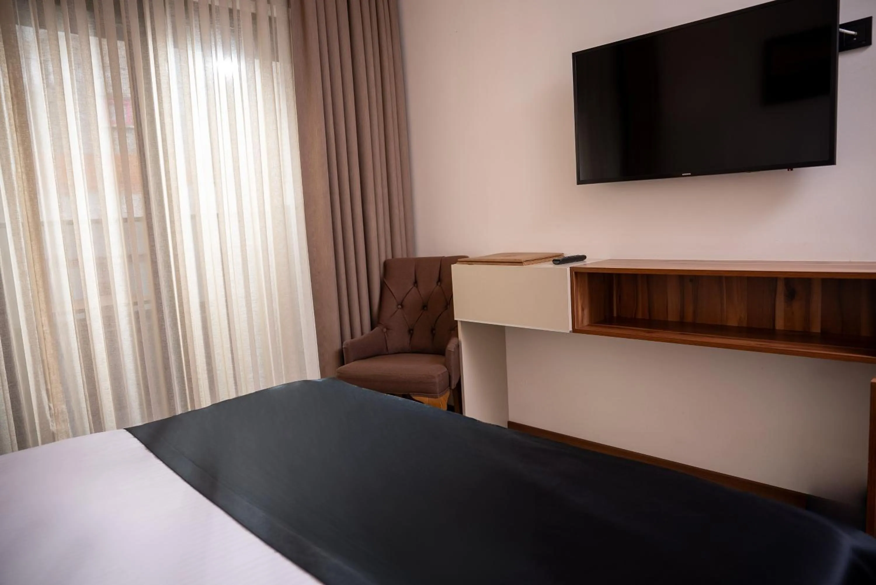 Bed in Mari Suites Hotel