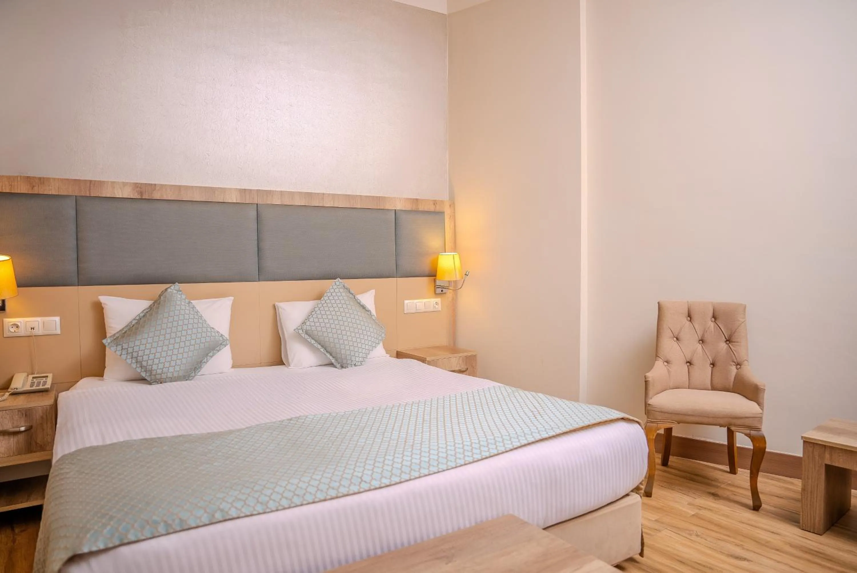 Bed in Mari Suites Hotel