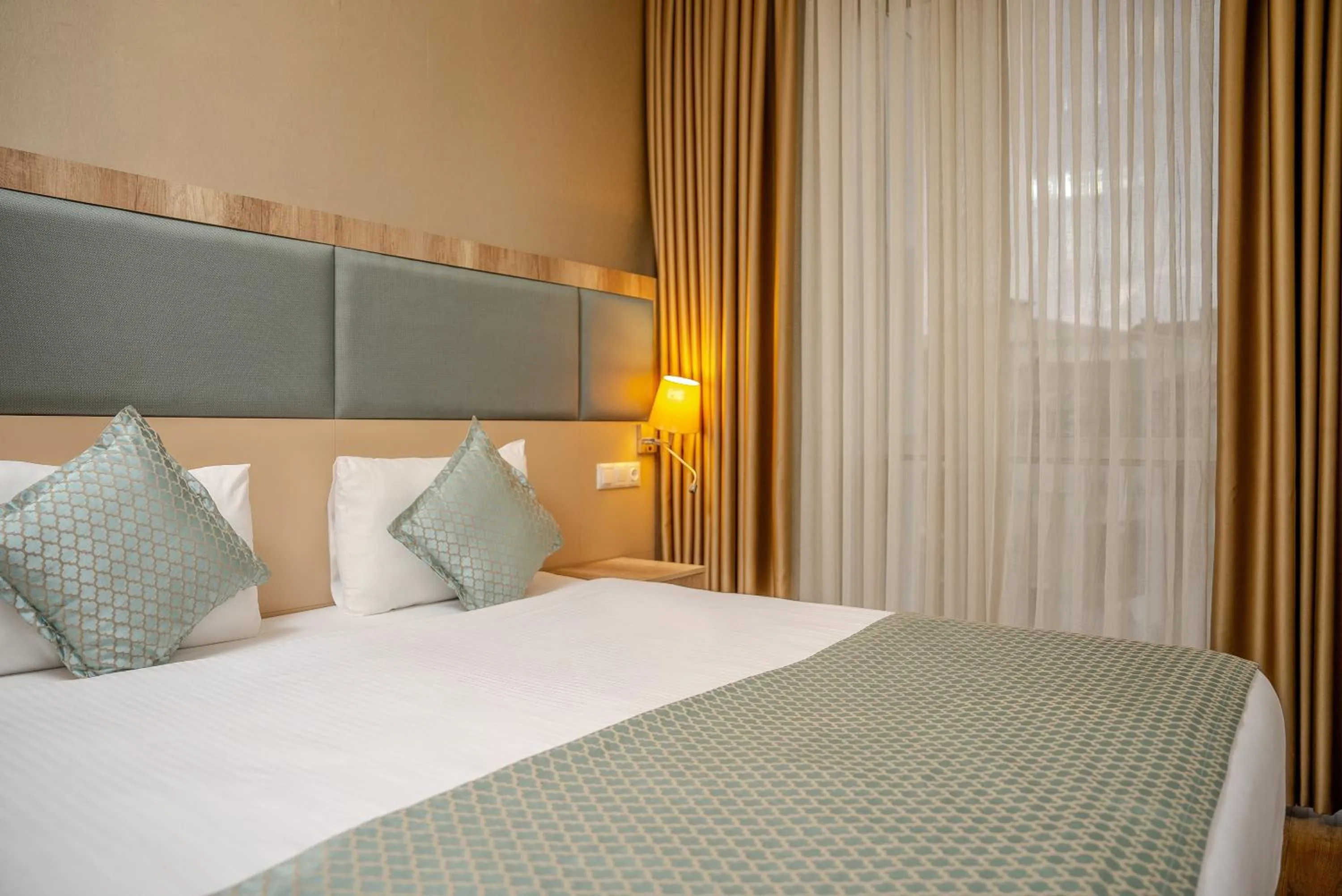 Bed in Mari Suites Hotel