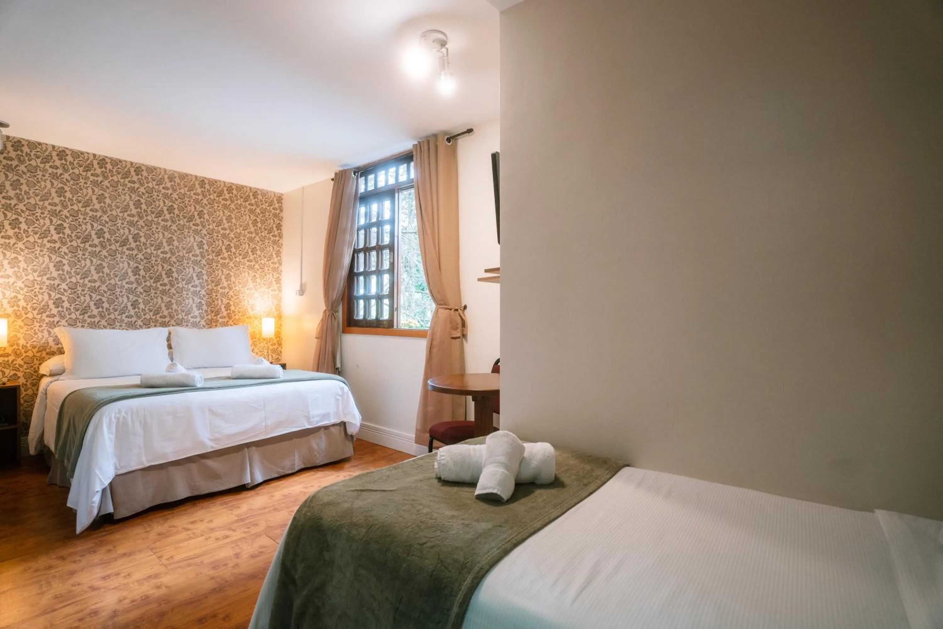 Bed in Pousada La Toscana Campos do Jordão