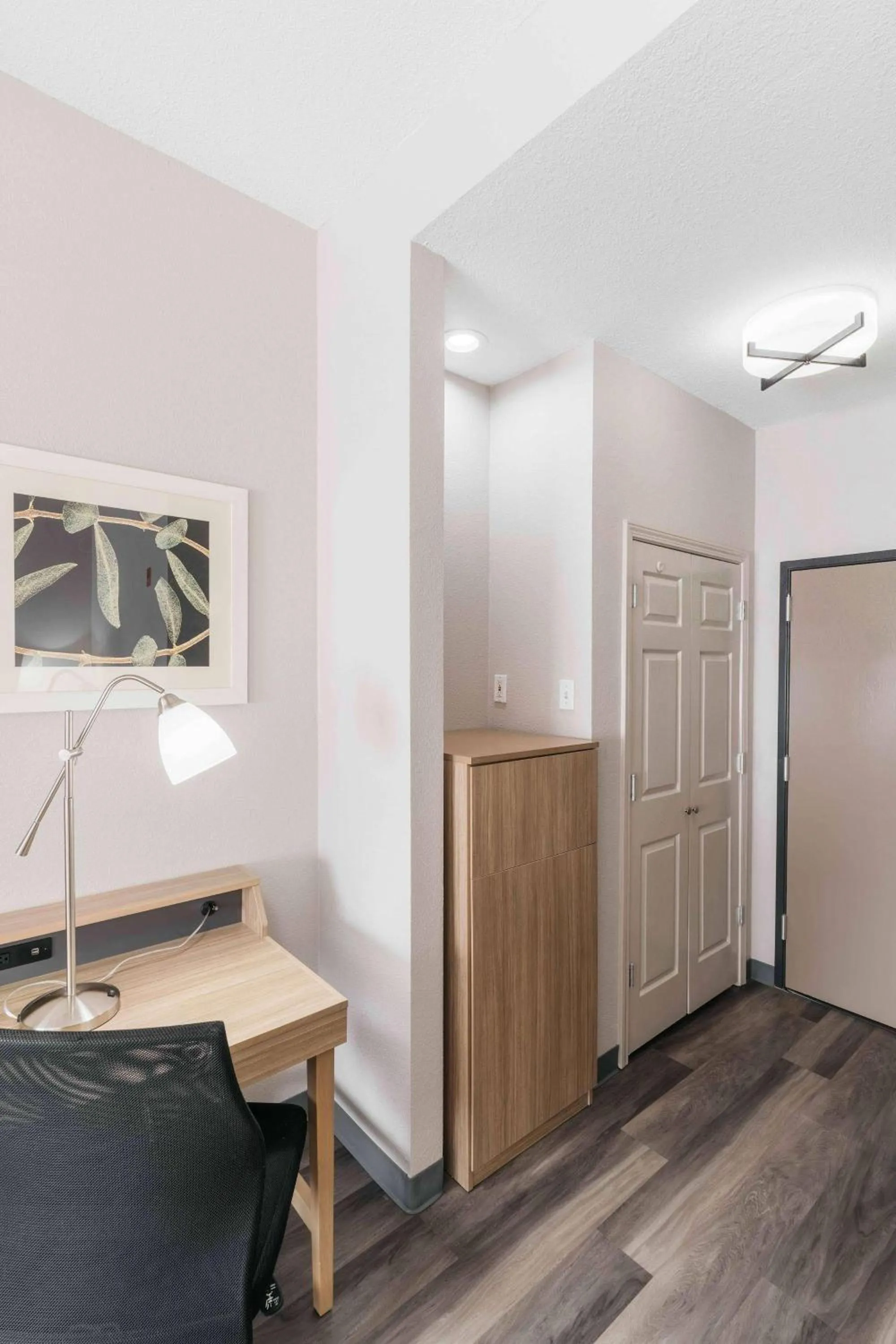 Bedroom in Townhome Inn & Suites by IHG