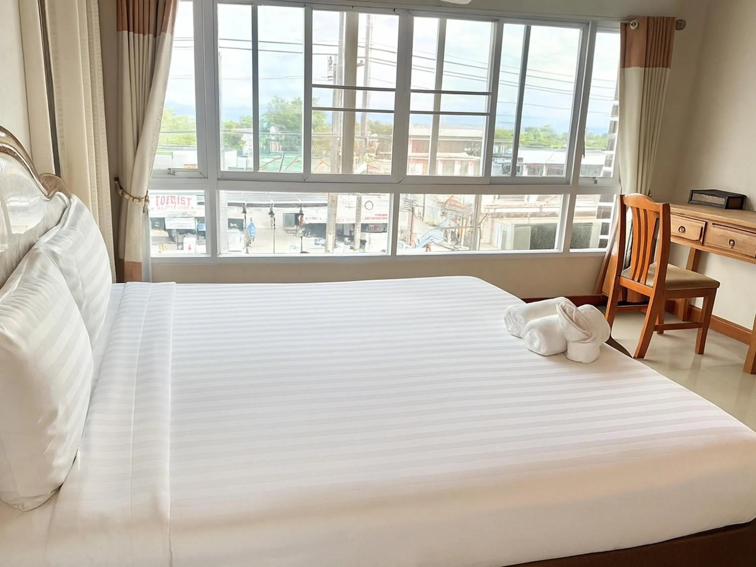 Photo of the whole room, Bed in Maekhong Delta Boutique Hotel