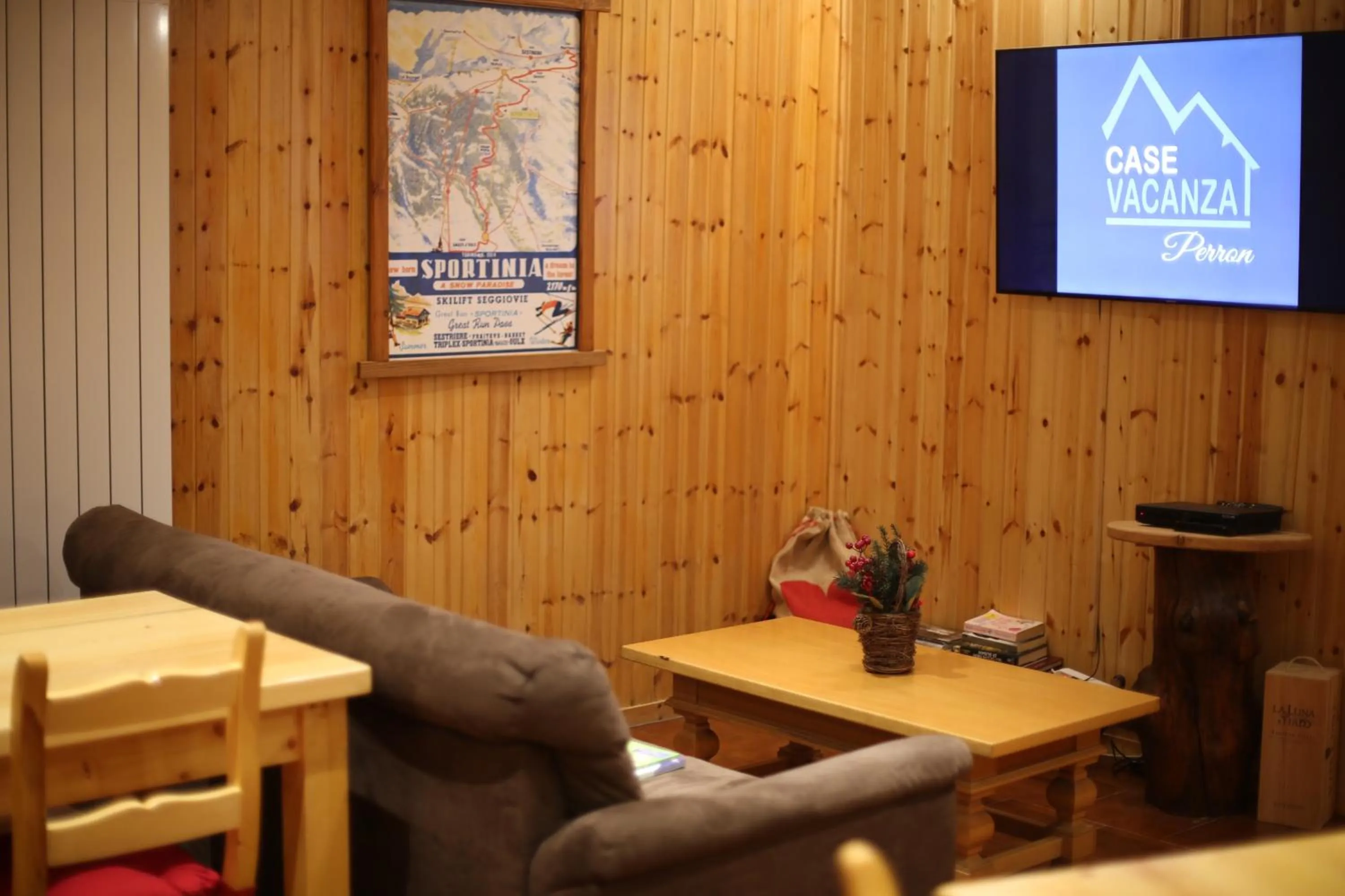 Communal lounge/ TV room in Case Vacanza Perron