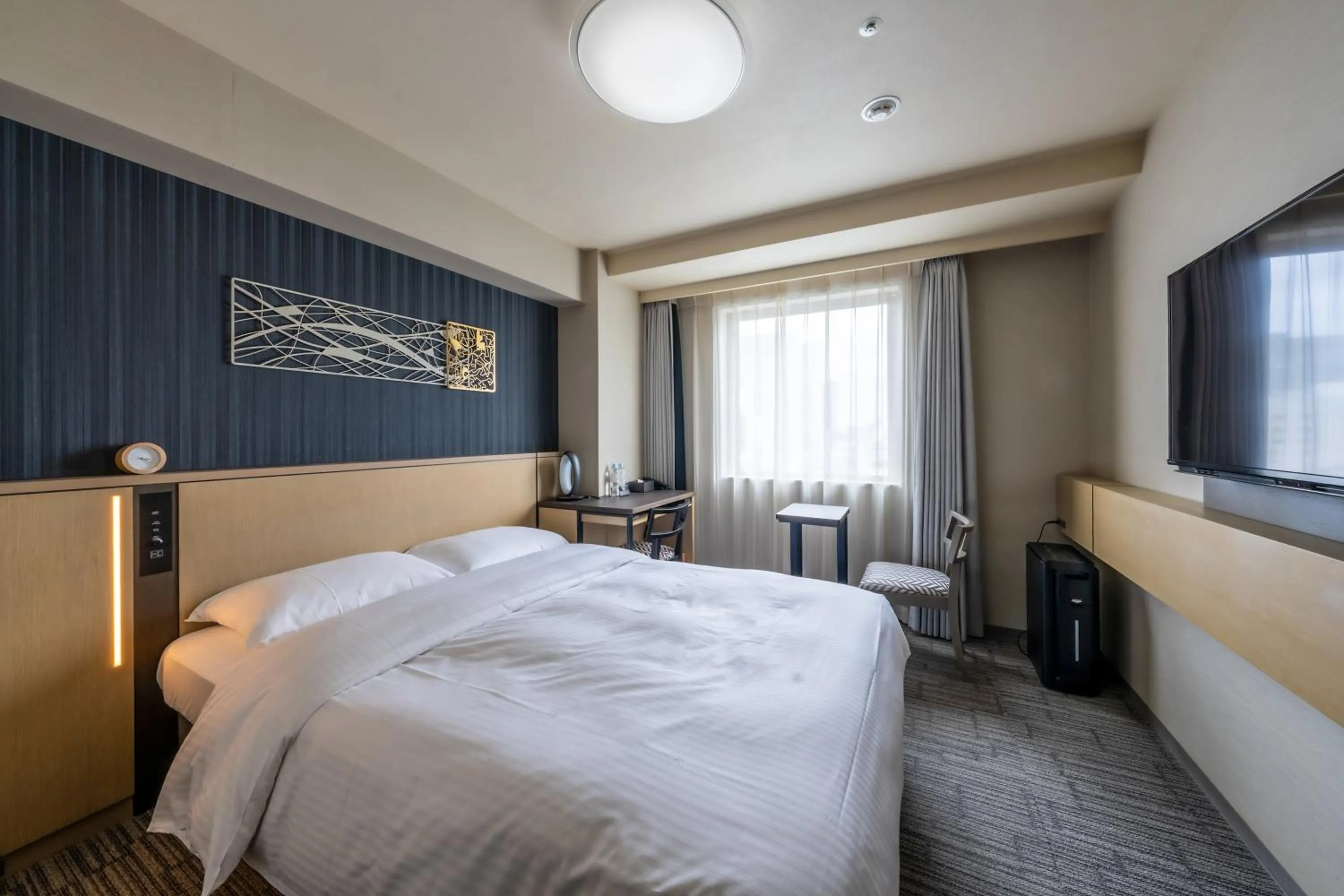 Bed in Richmond Hotel Yokohama Ekimae