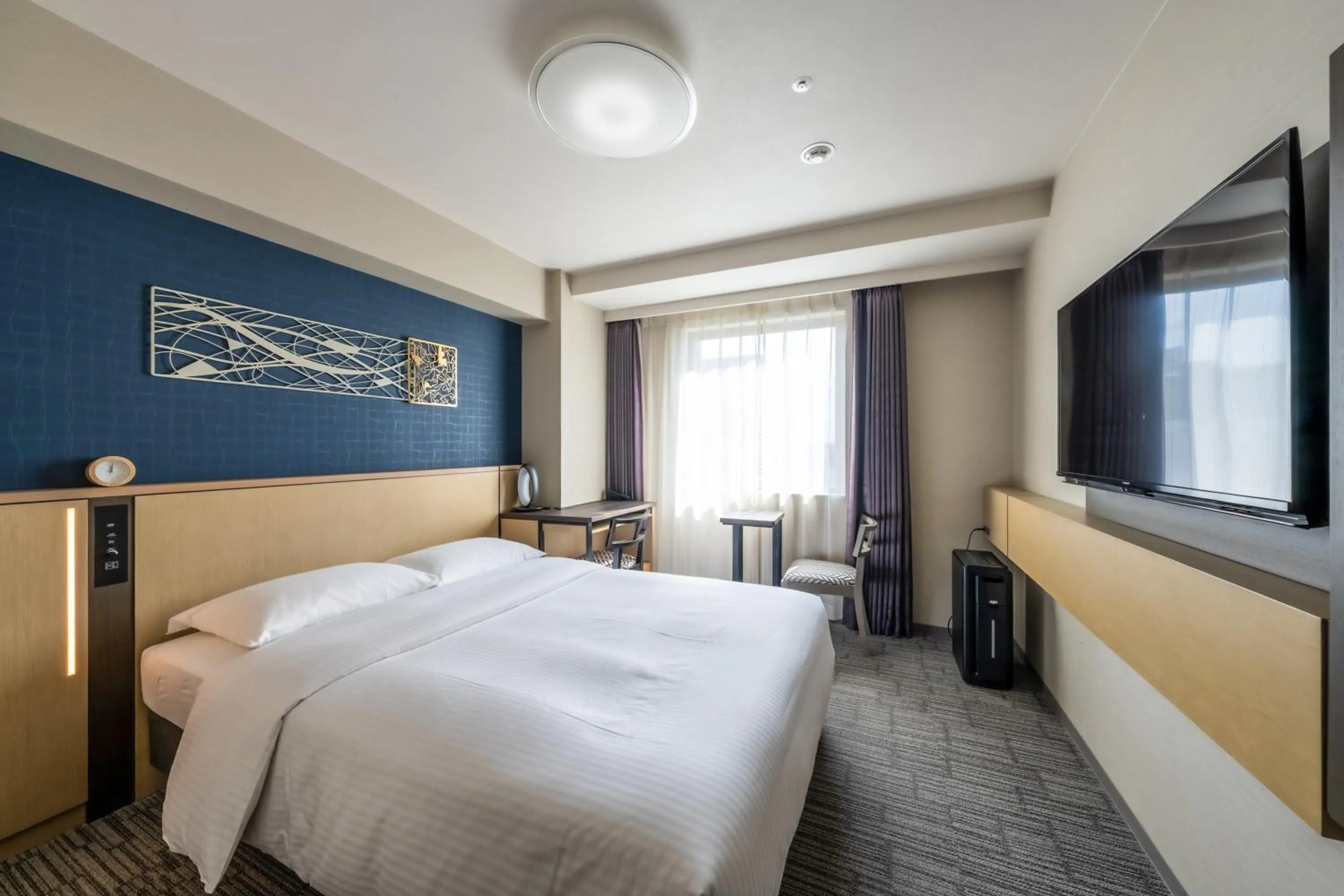 Bed in Richmond Hotel Yokohama Ekimae